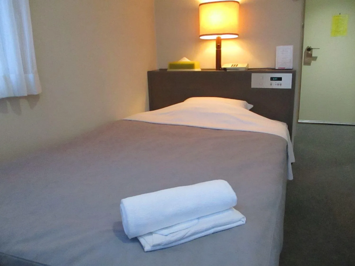 Bed in Hotel Heart Inn