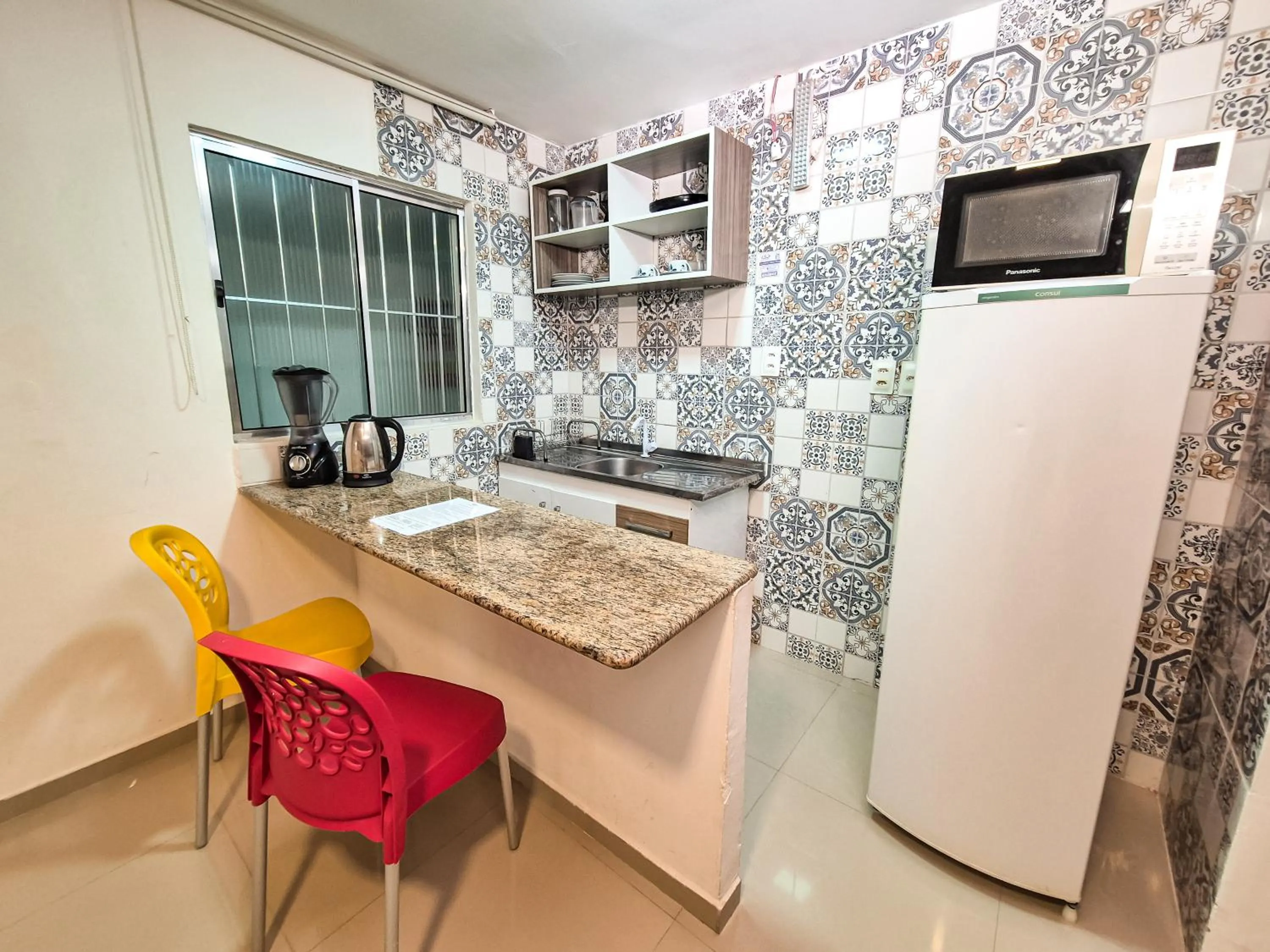 Kitchen or kitchenette in Pousada Cheiro do Mar