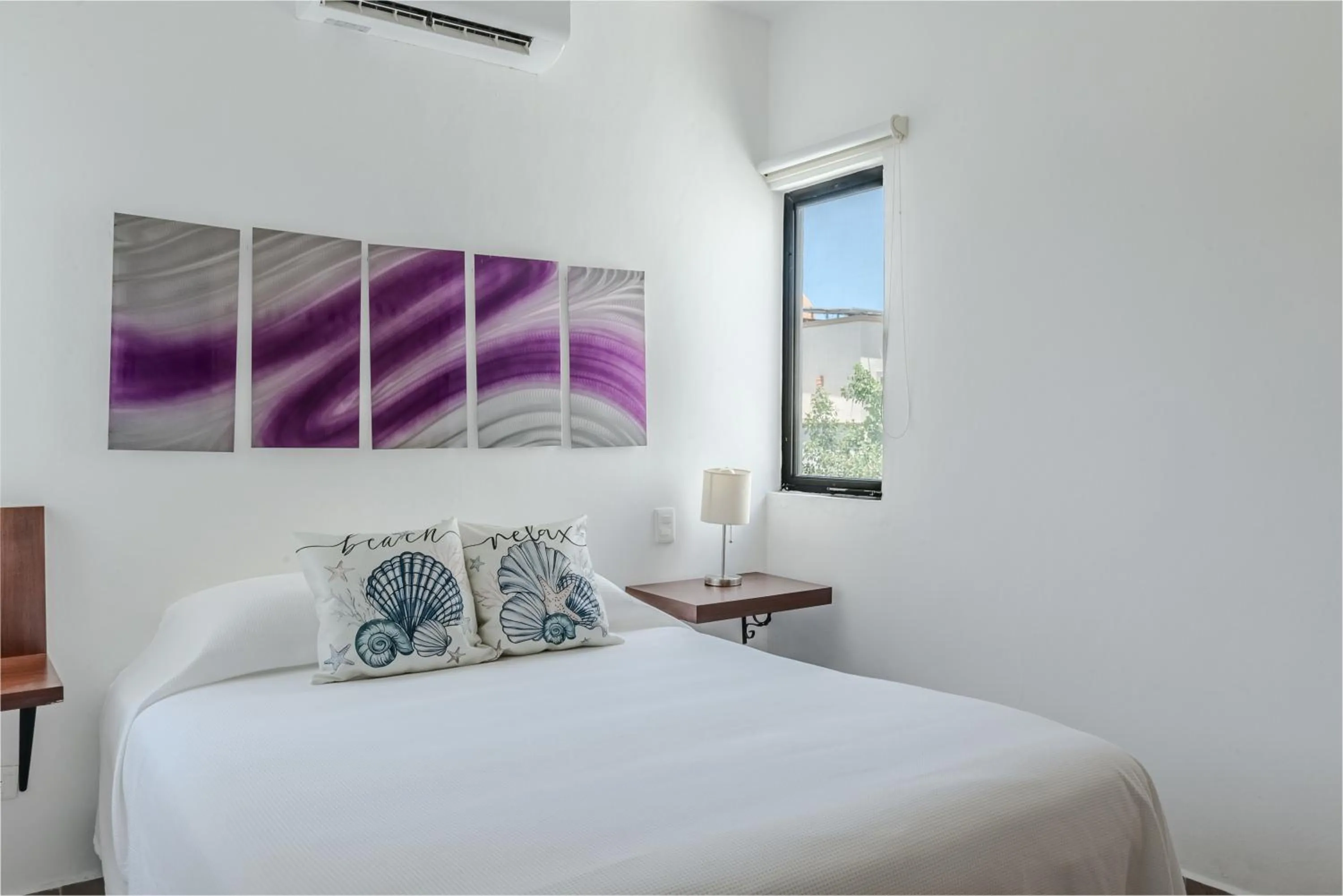 Bed in Vela's Condos Ocean Front