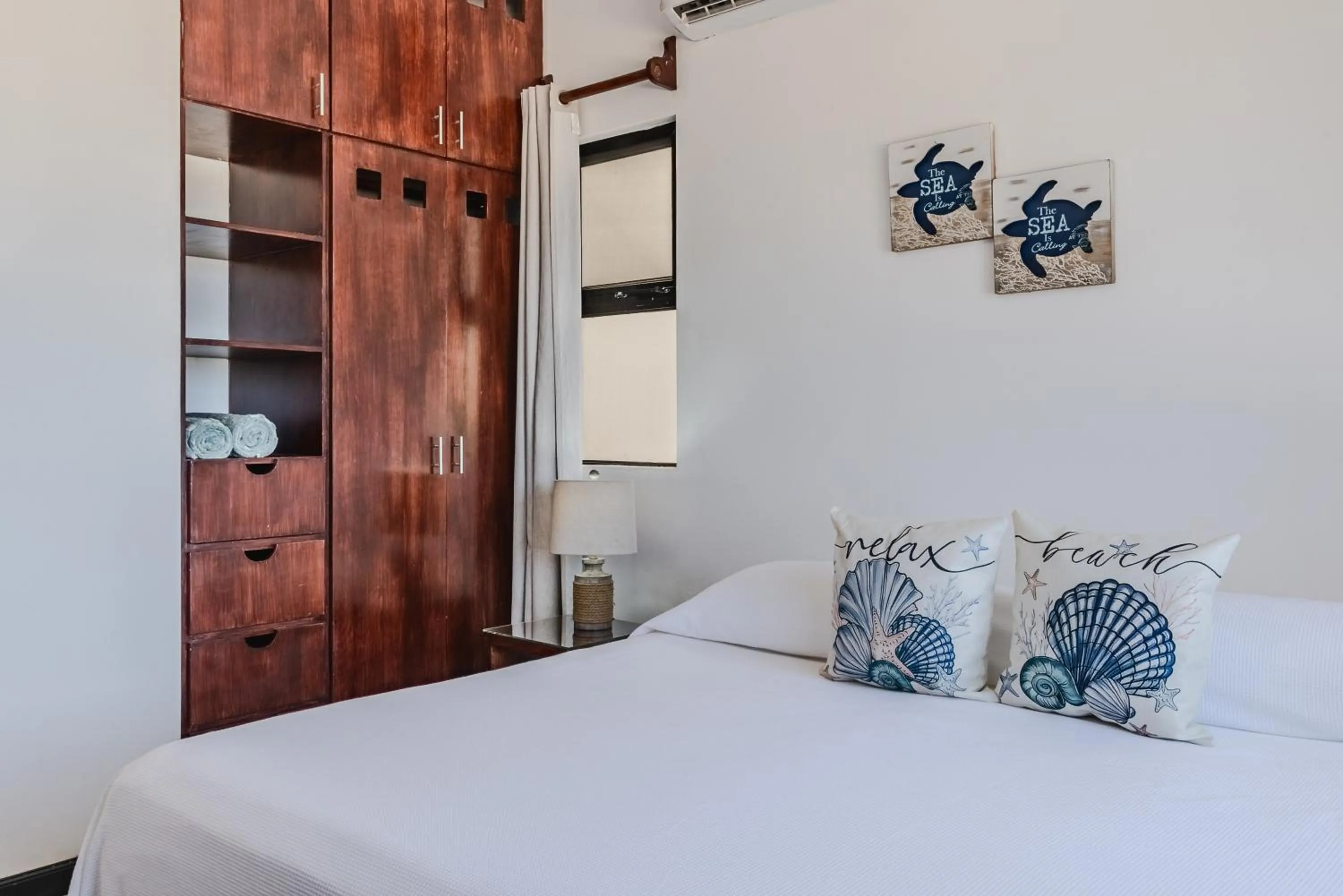 Bed in Vela's Condos Ocean Front