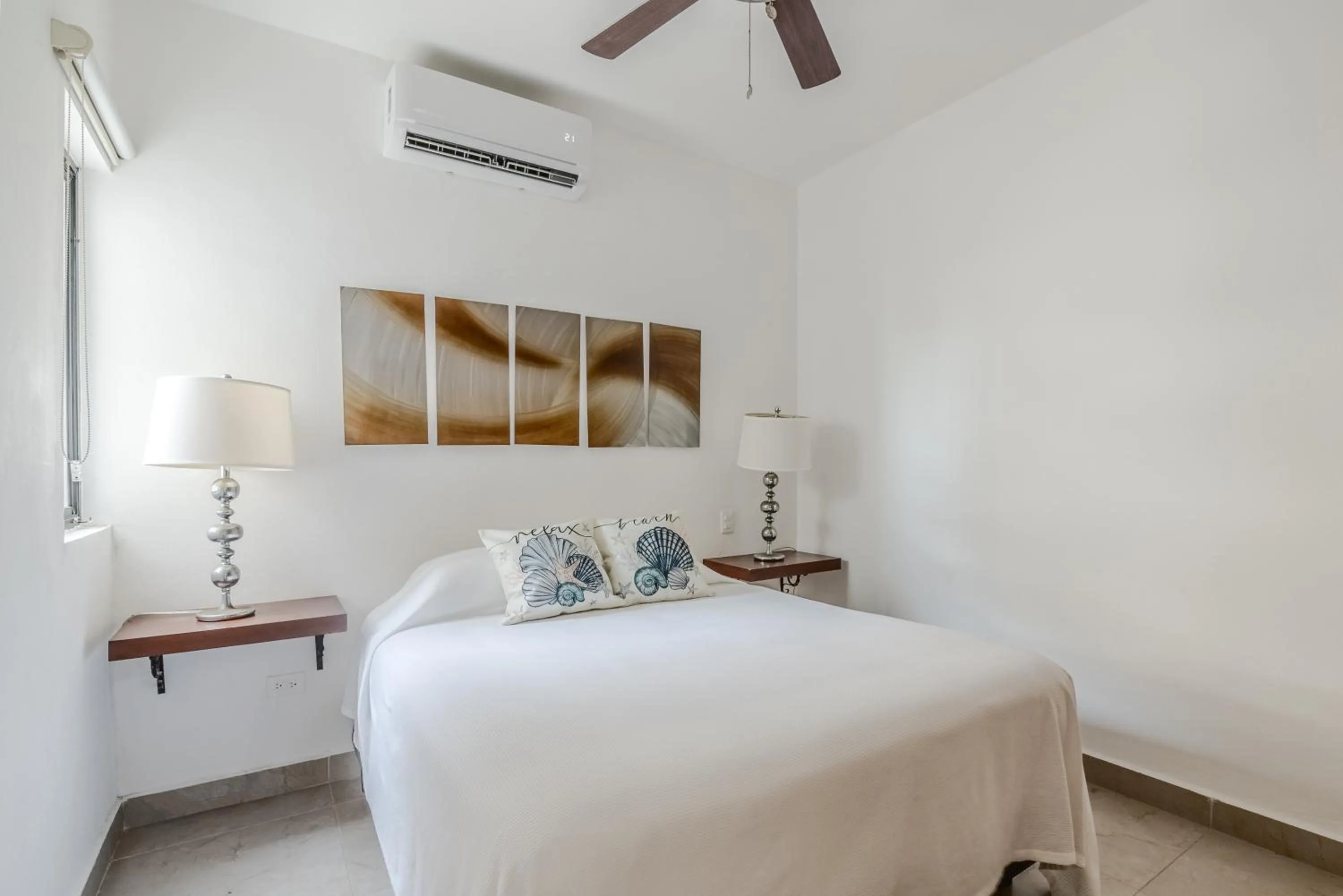 Bed in Vela's Condos Ocean Front