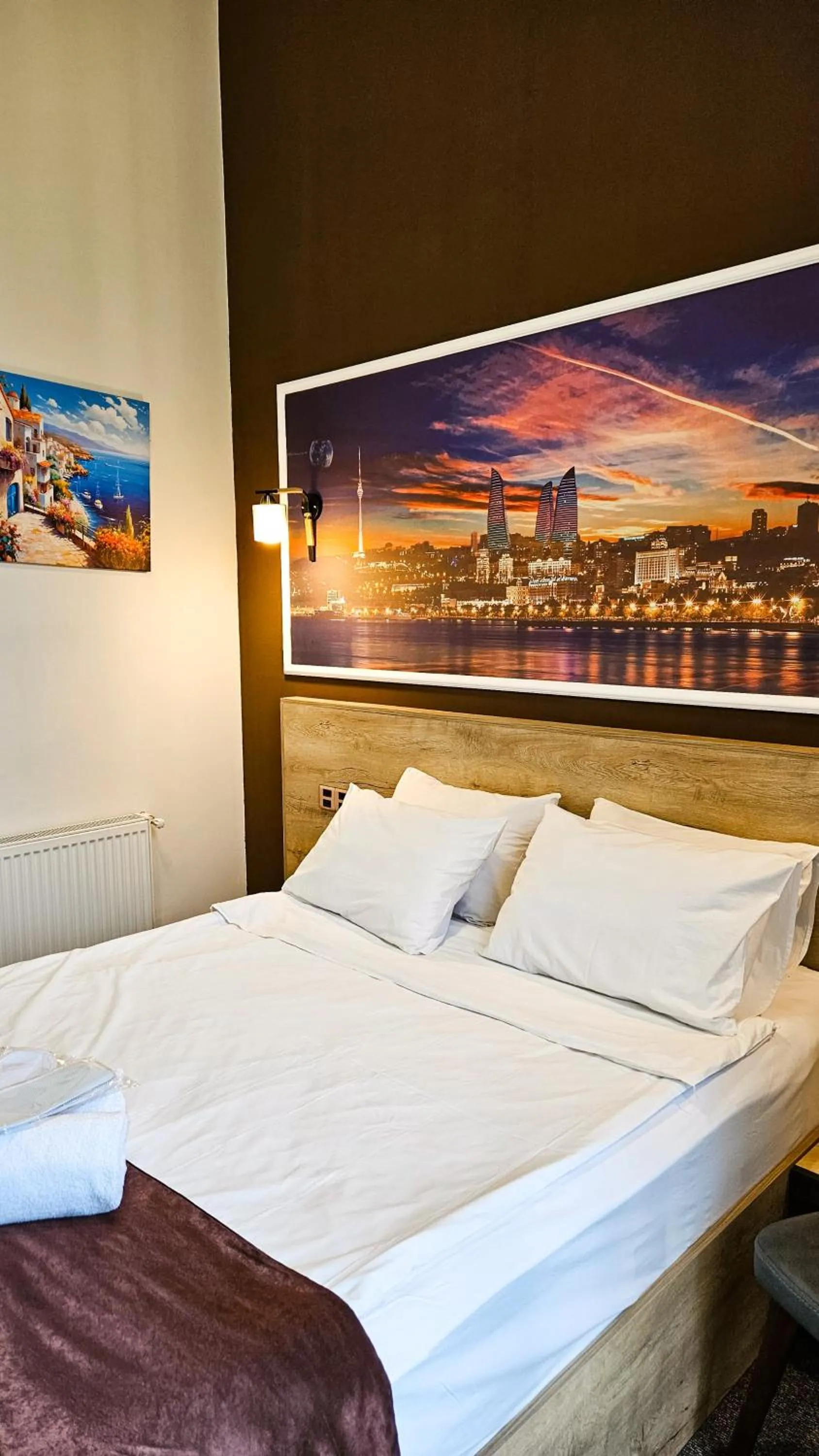 Bed in ELYSIUM HOTEL