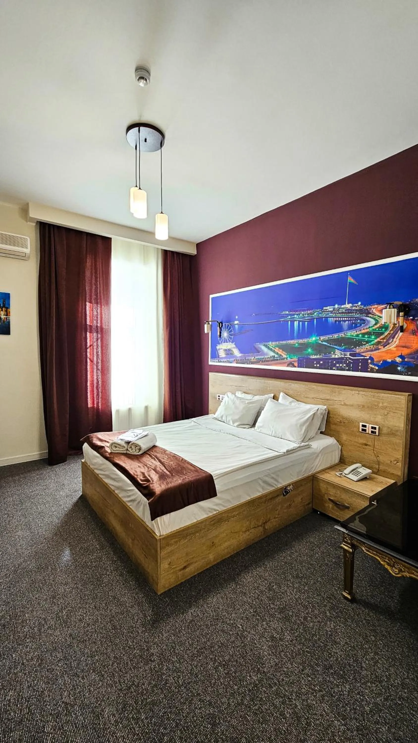 Bed in ELYSIUM HOTEL