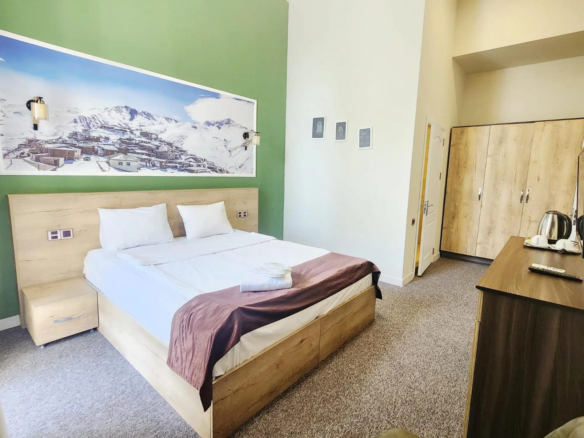 Bed in ELYSIUM HOTEL