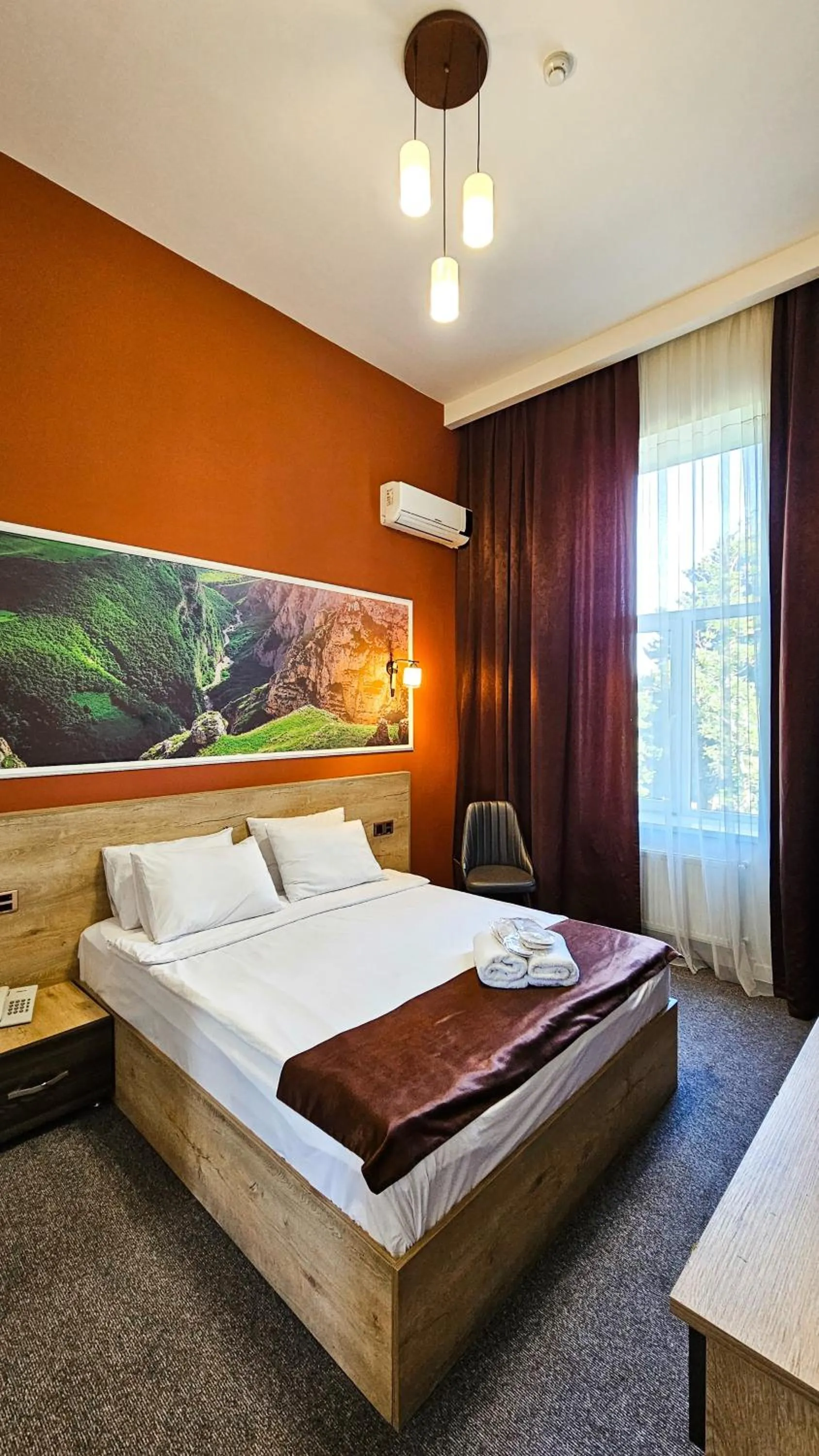 Bed in ELYSIUM HOTEL