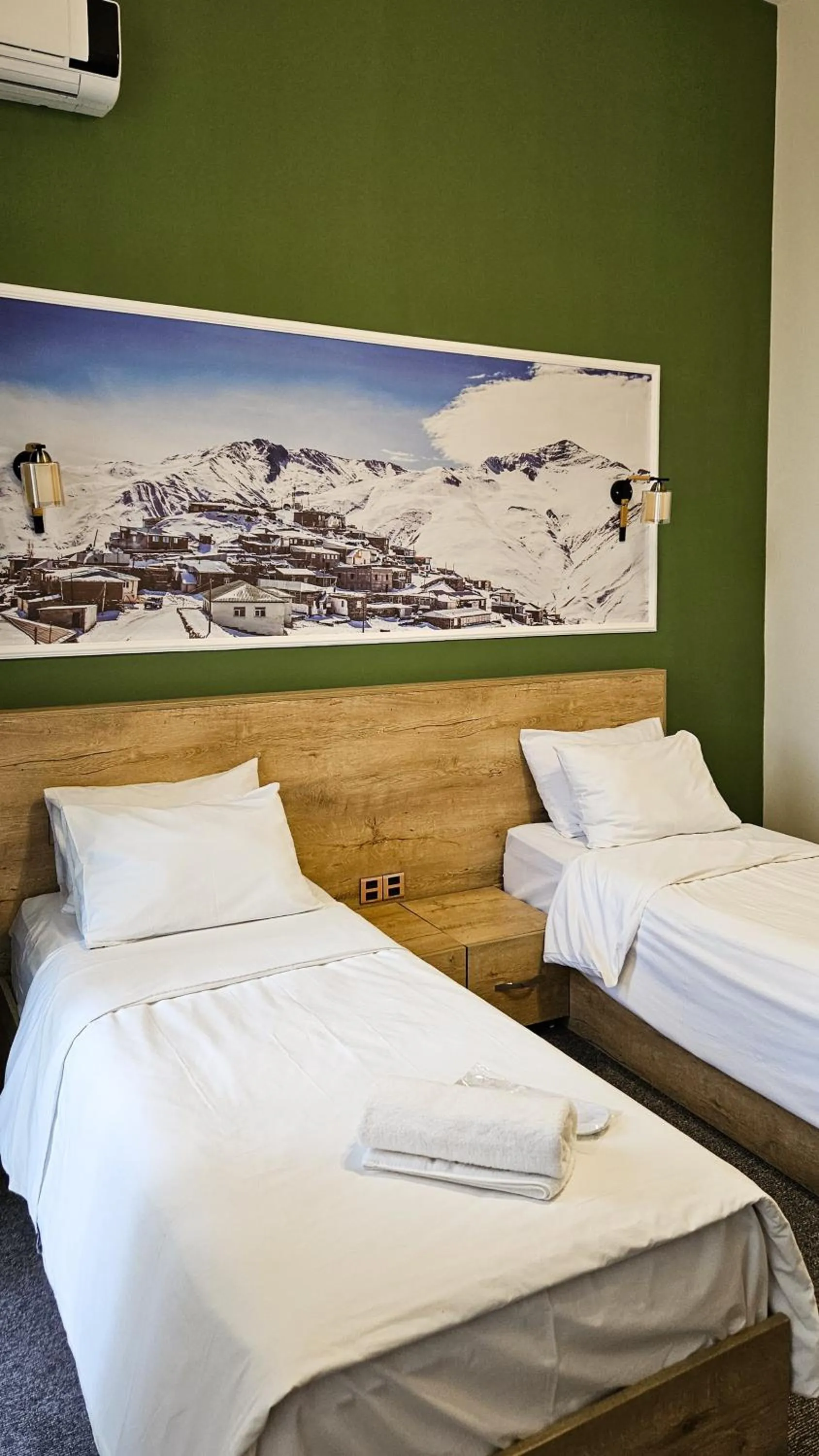 Bed in ELYSIUM HOTEL