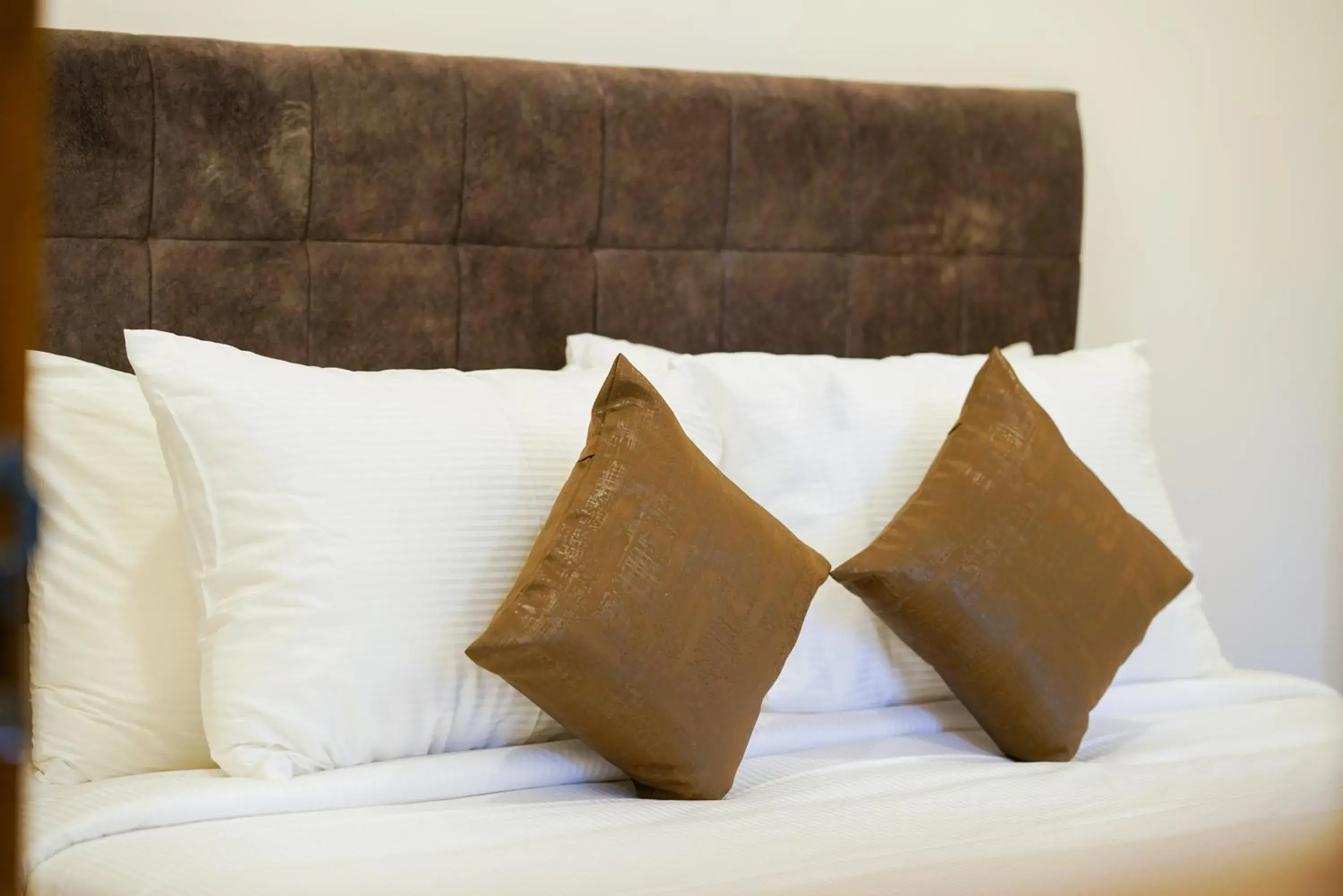 Bed in Grand Plaza Inn Bed in Grand Plaza Inn