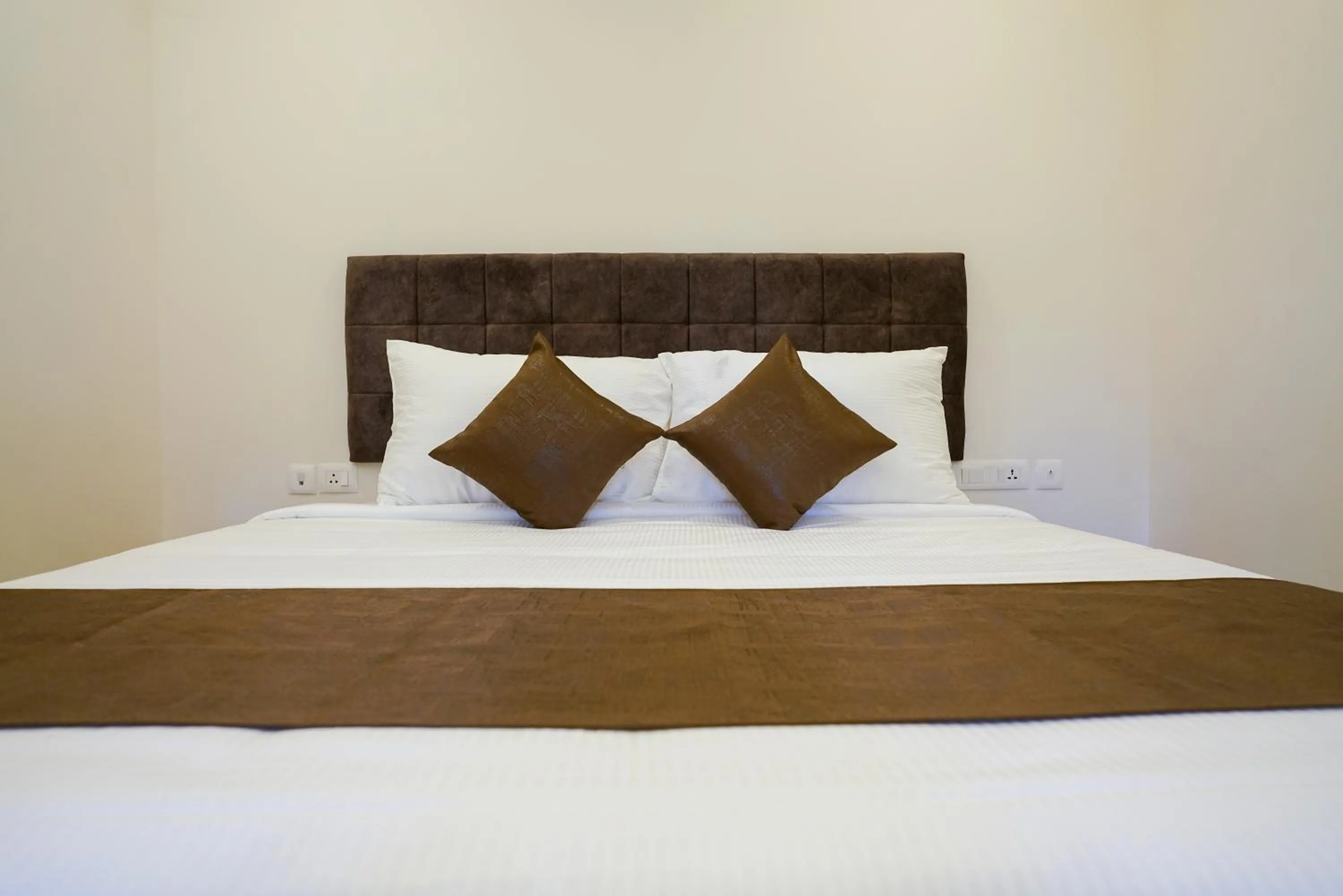 Bed in Grand Plaza Inn