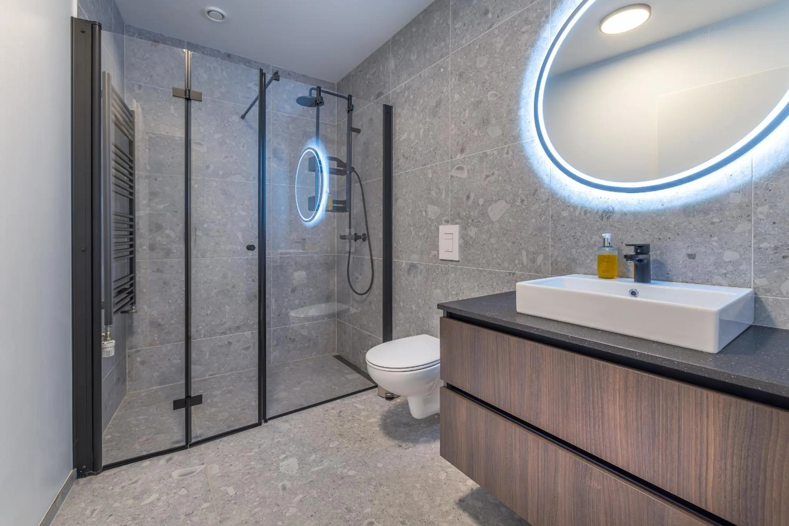 Shower in Hlemmur Suites