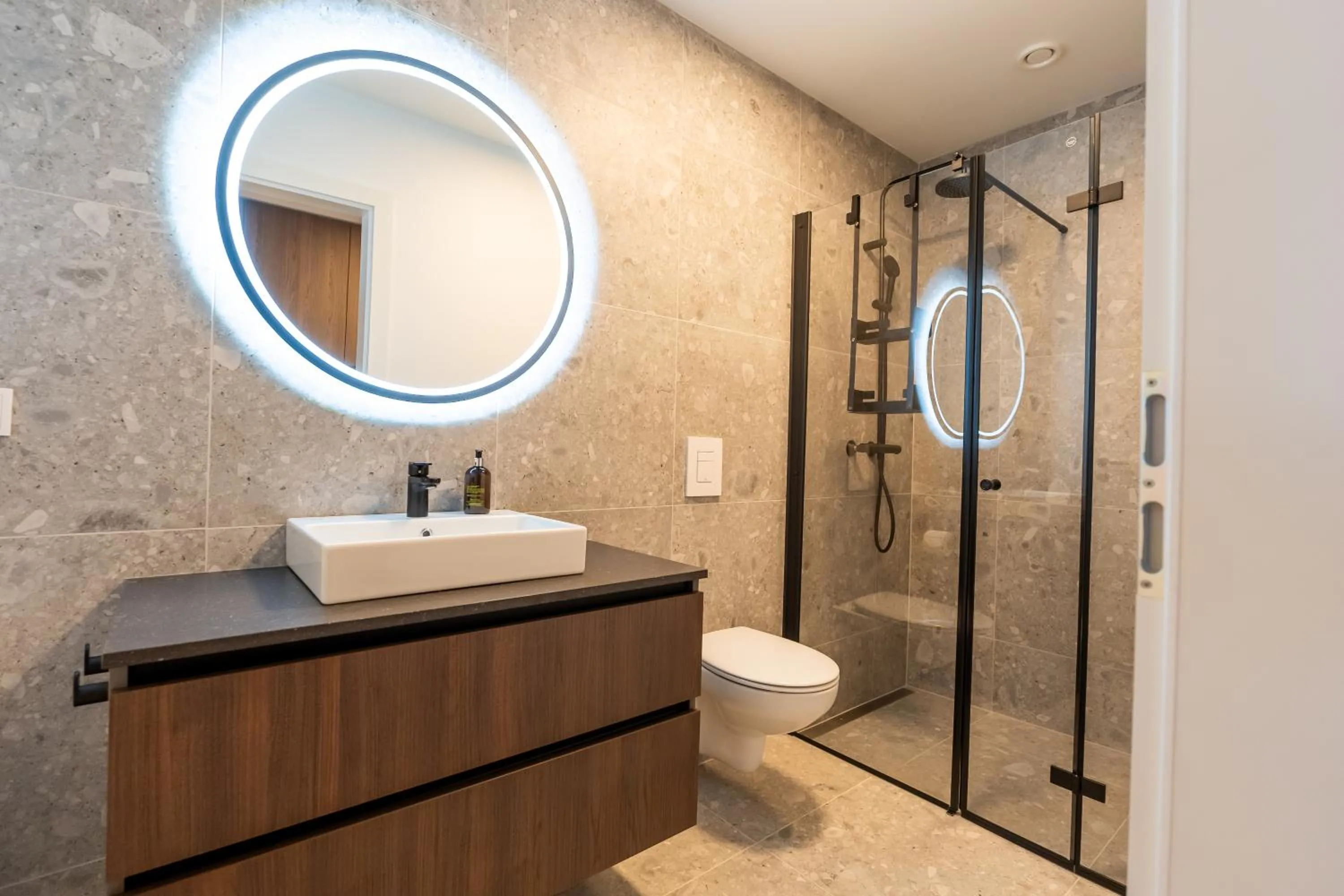 Shower in Hlemmur Suites