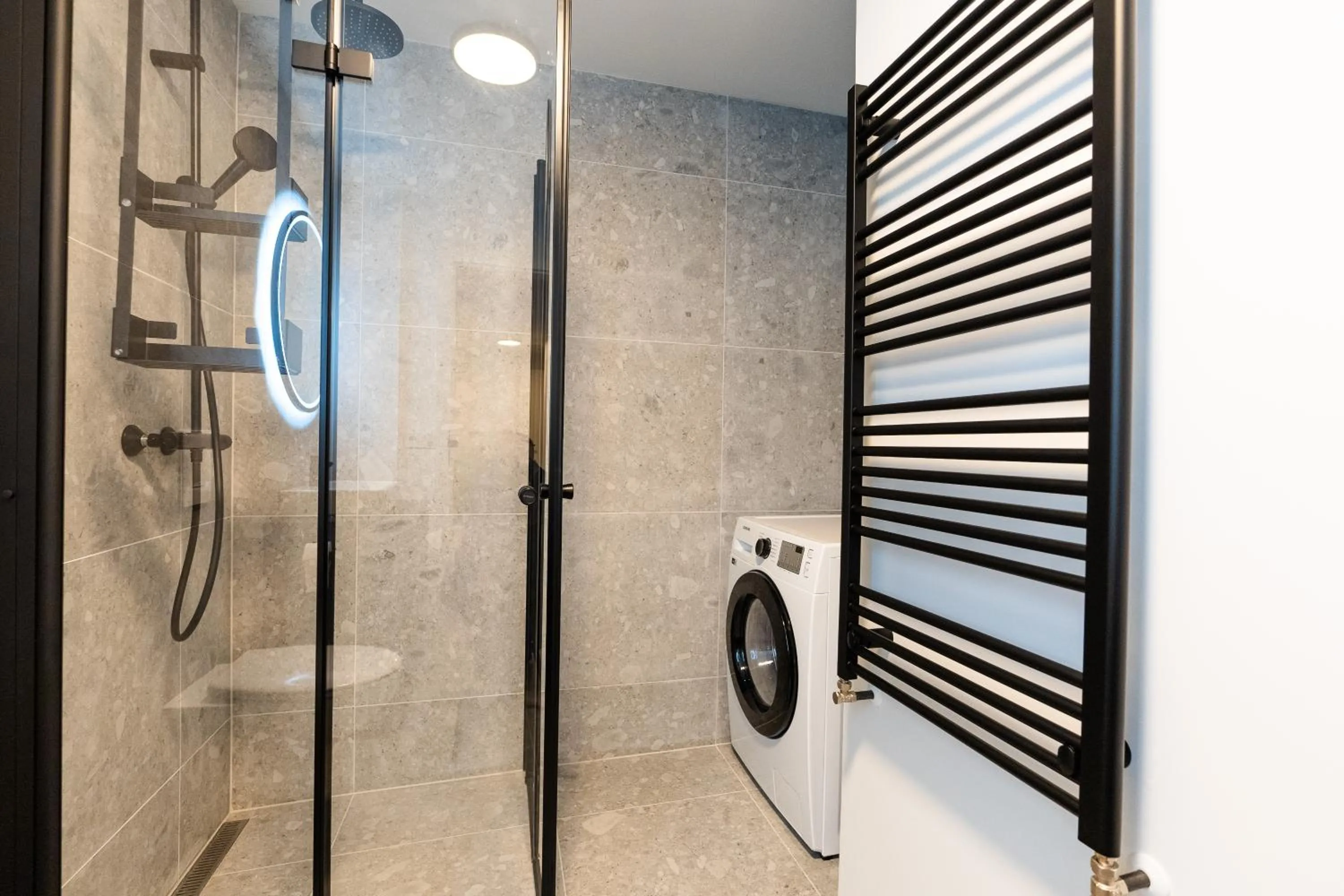 Shower in Hlemmur Suites