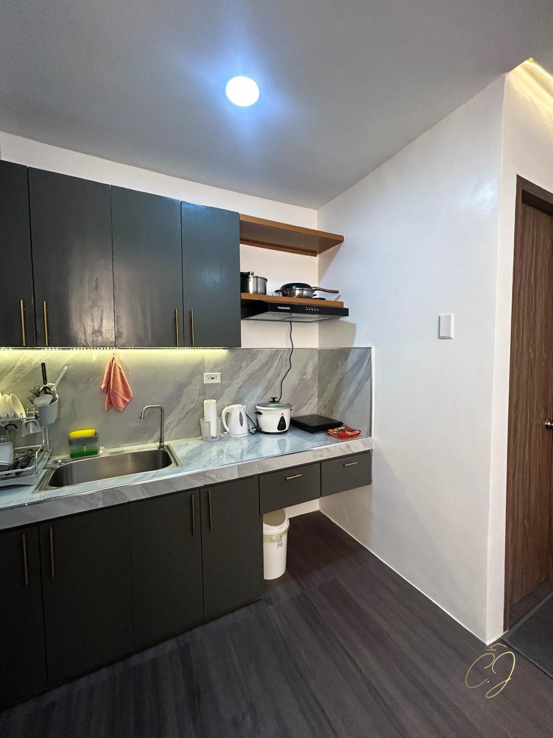 Kitchen or kitchenette in CJ Apartments
