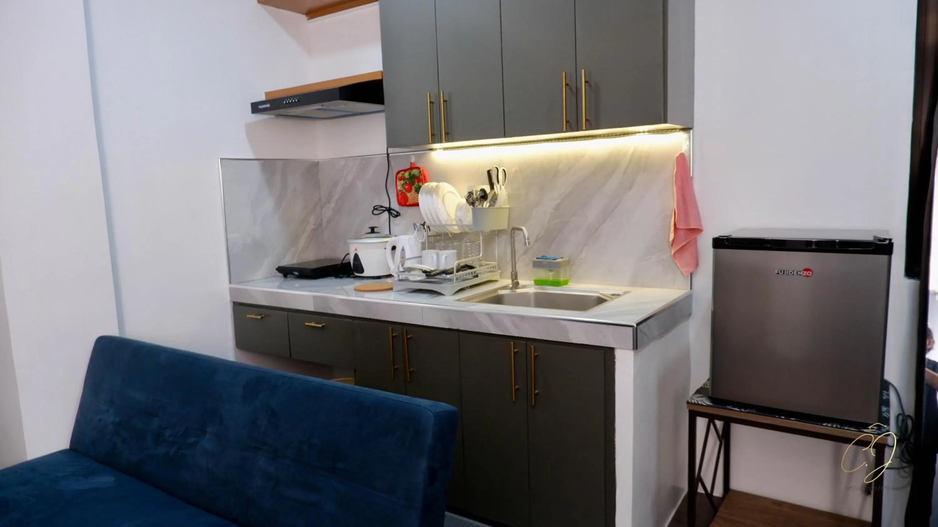 Kitchen or kitchenette in CJ Apartments