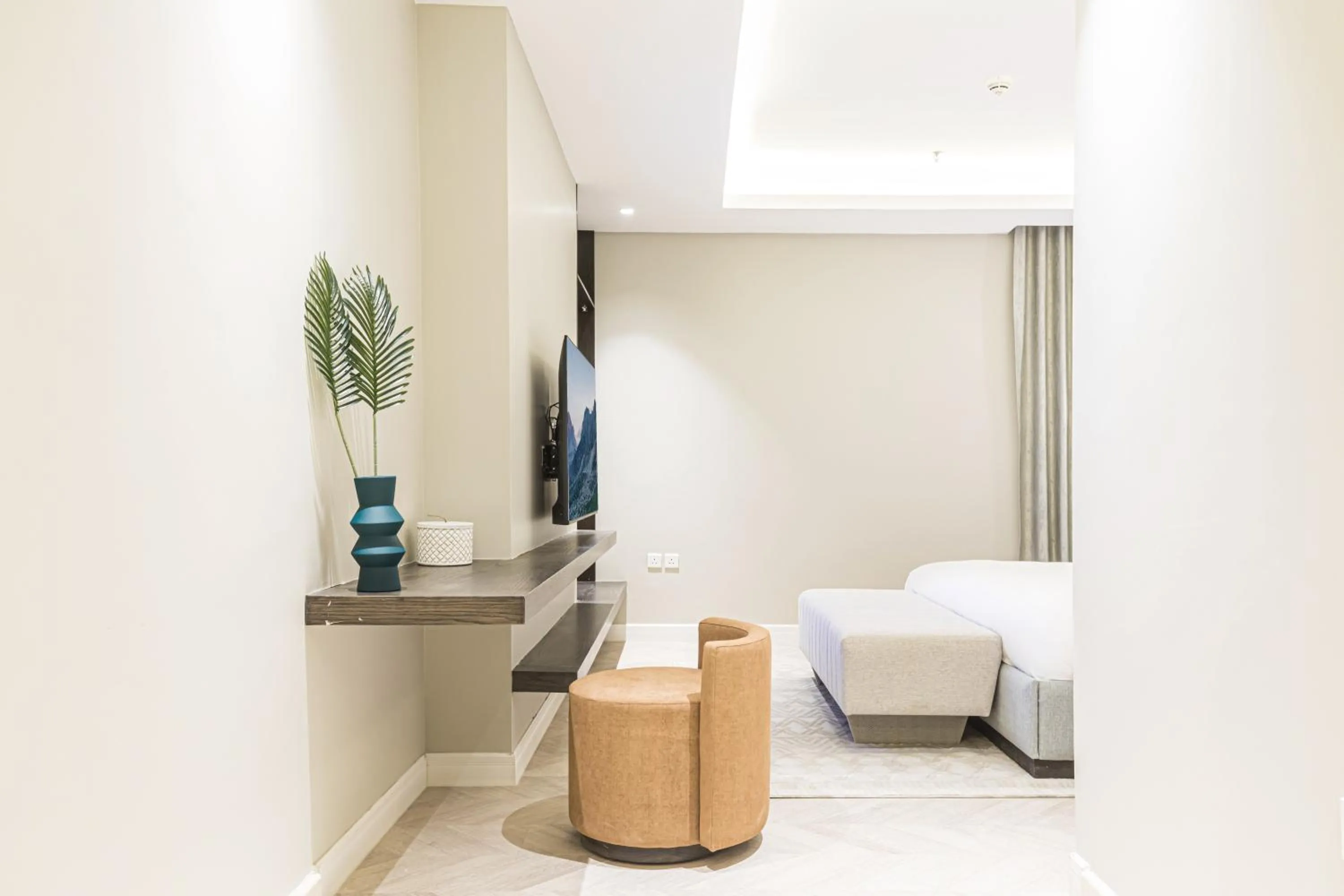 Seating area, Bed in Stella Stays Olaya Tower 1