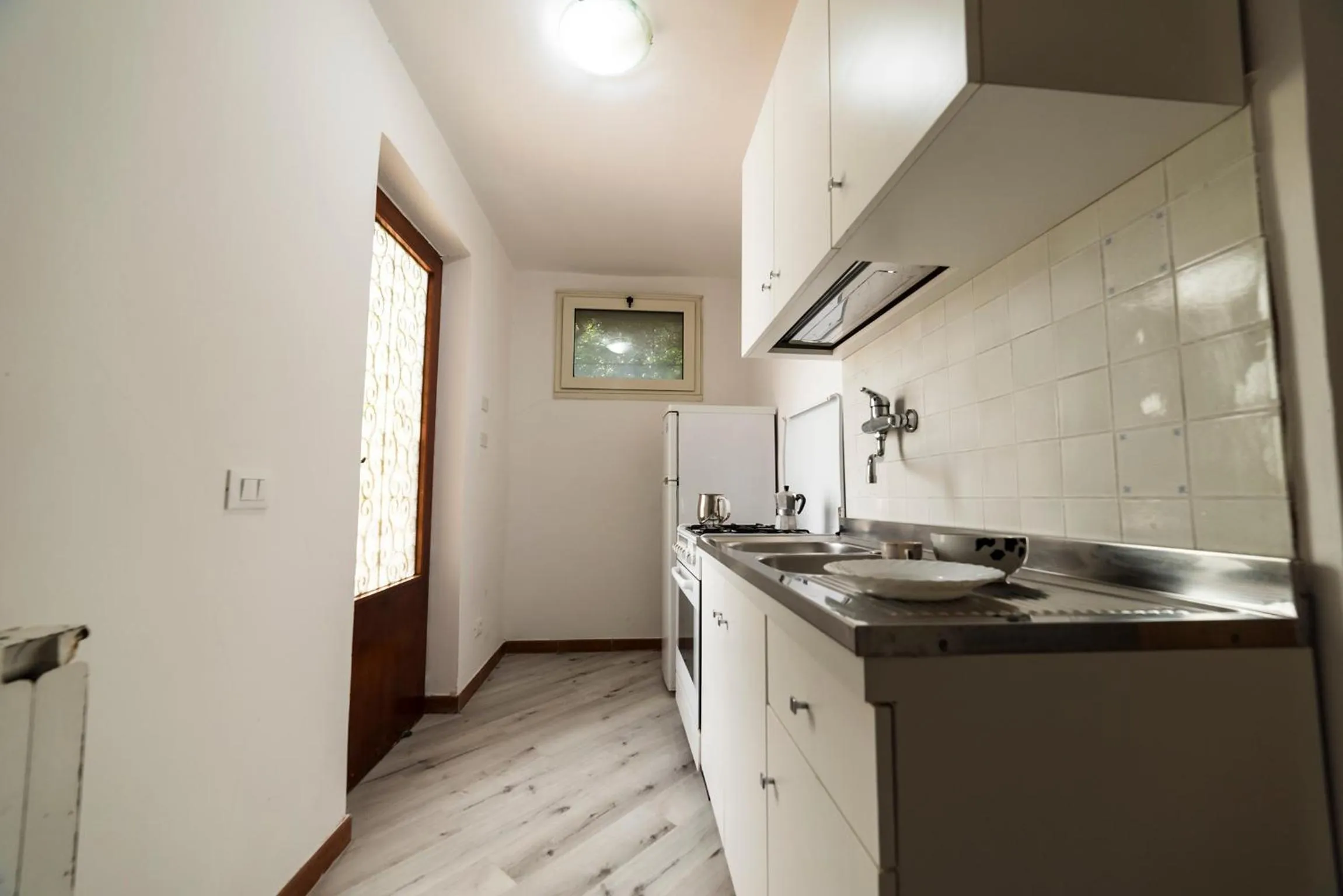 Kitchen or kitchenette in Un Ospite a Fontania
