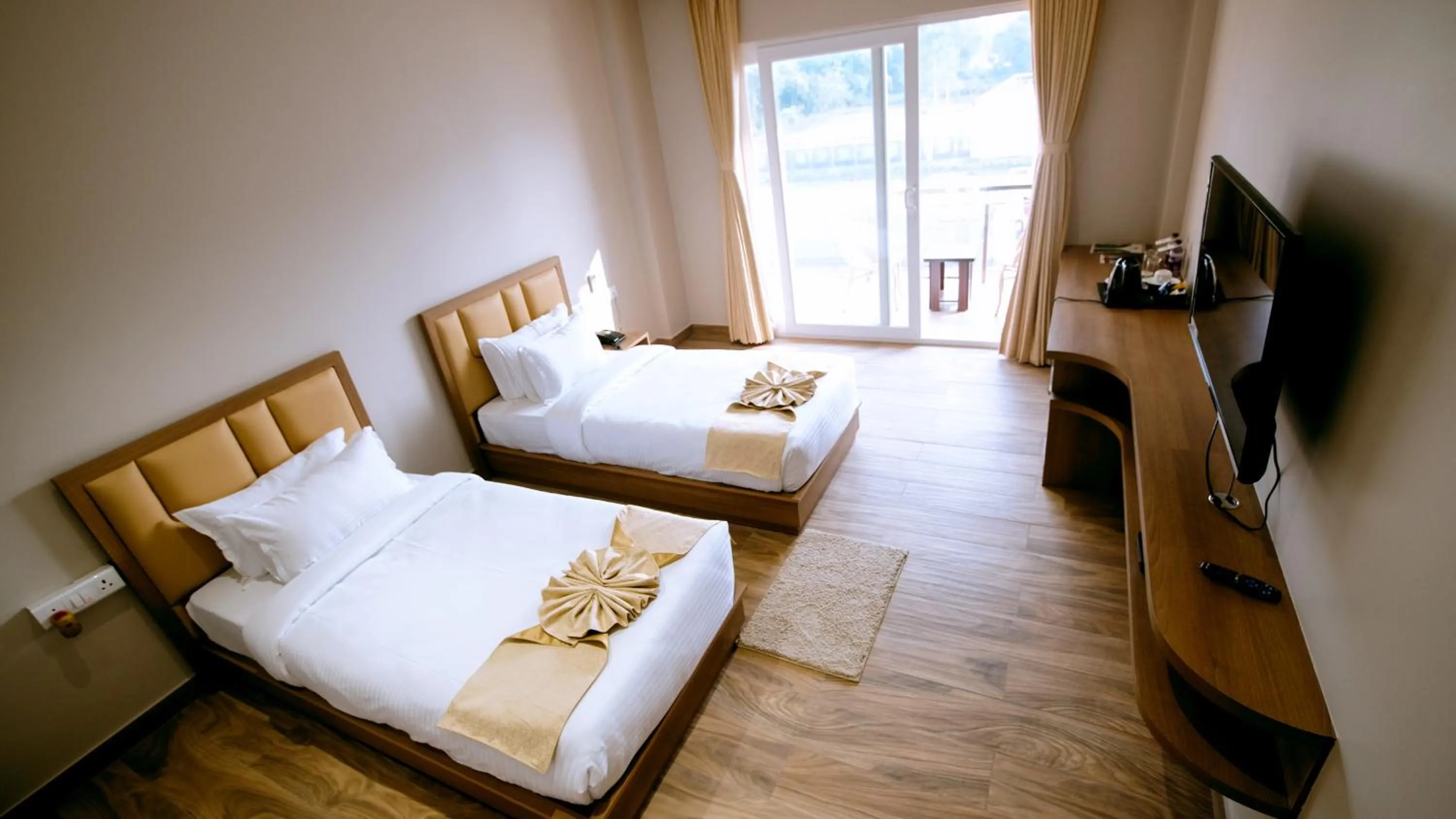 Bed in Finn's Weaver Resort, Kaziranga