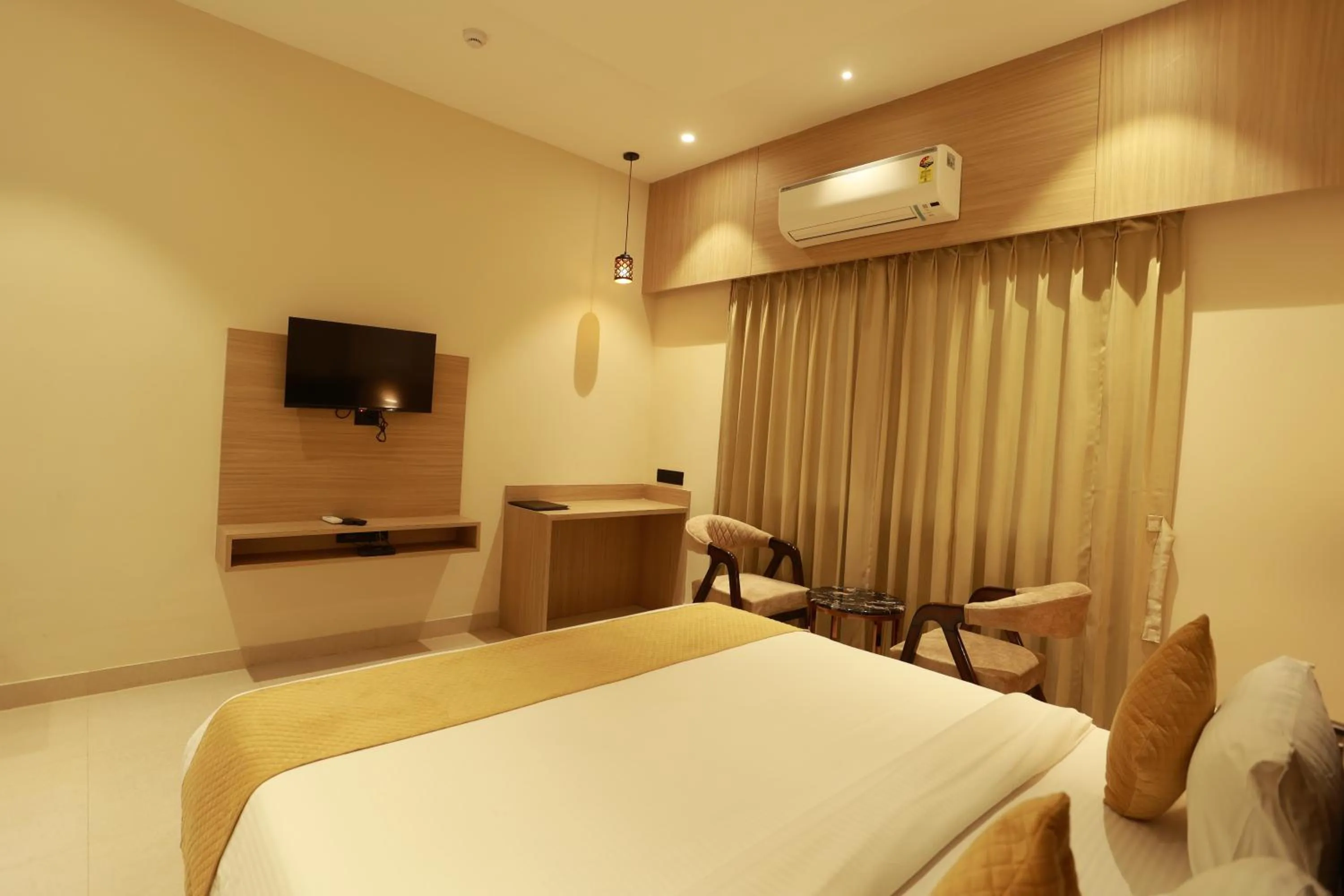 Bed in Hotel Taviral Regency