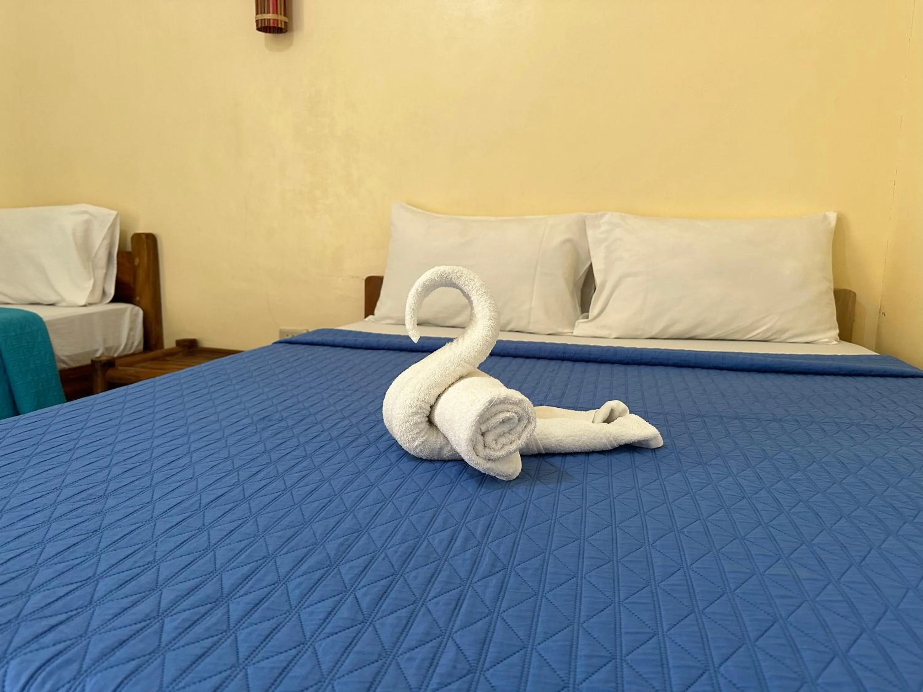 Bed in Dancalan Beach Resort