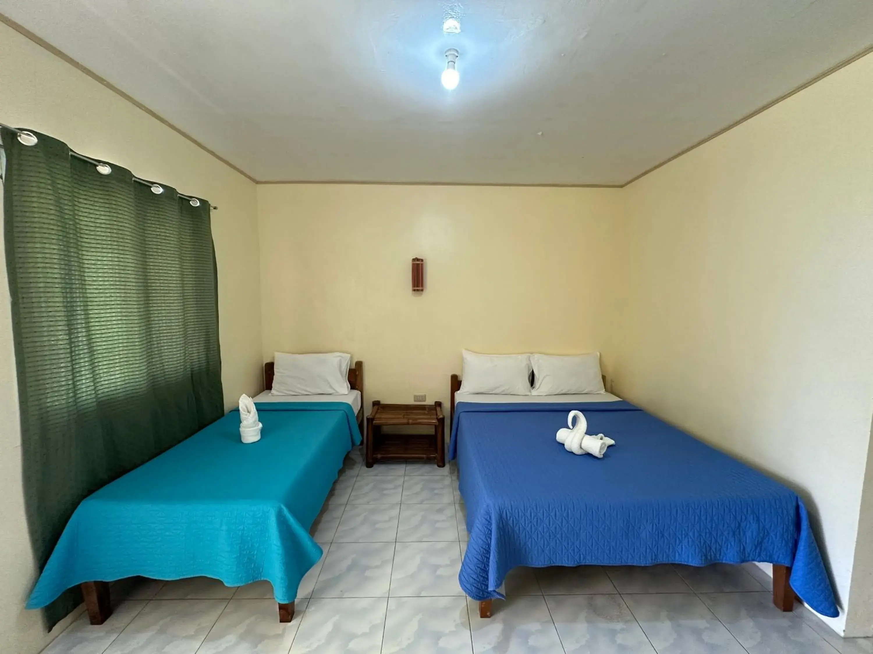 Bed in Dancalan Beach Resort Bed in Dancalan Beach Resort