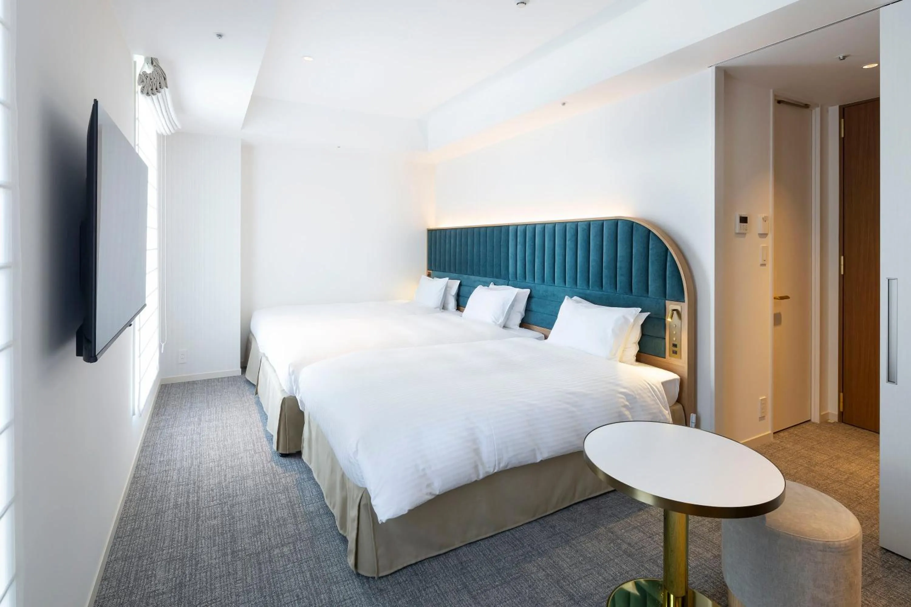 Bed in Hotel Comento Yokohama Kannai