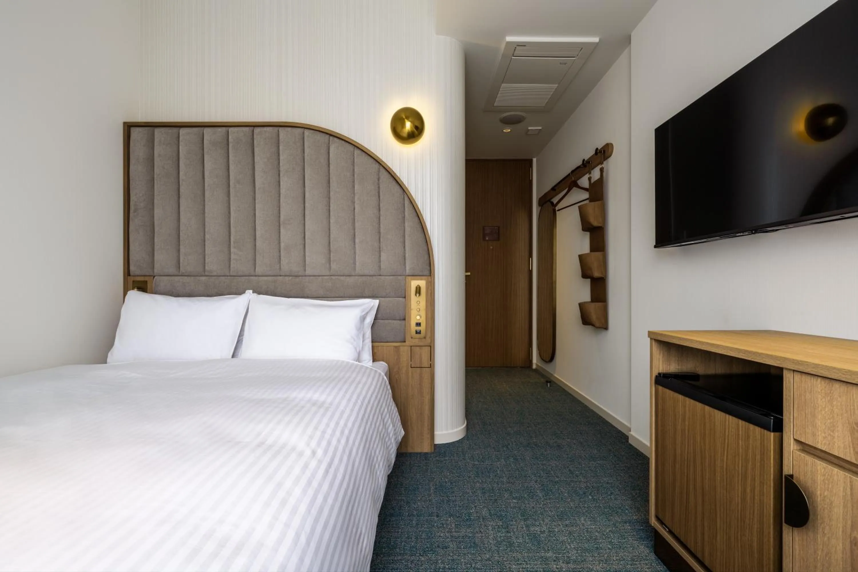 Bed in Hotel Comento Yokohama Kannai