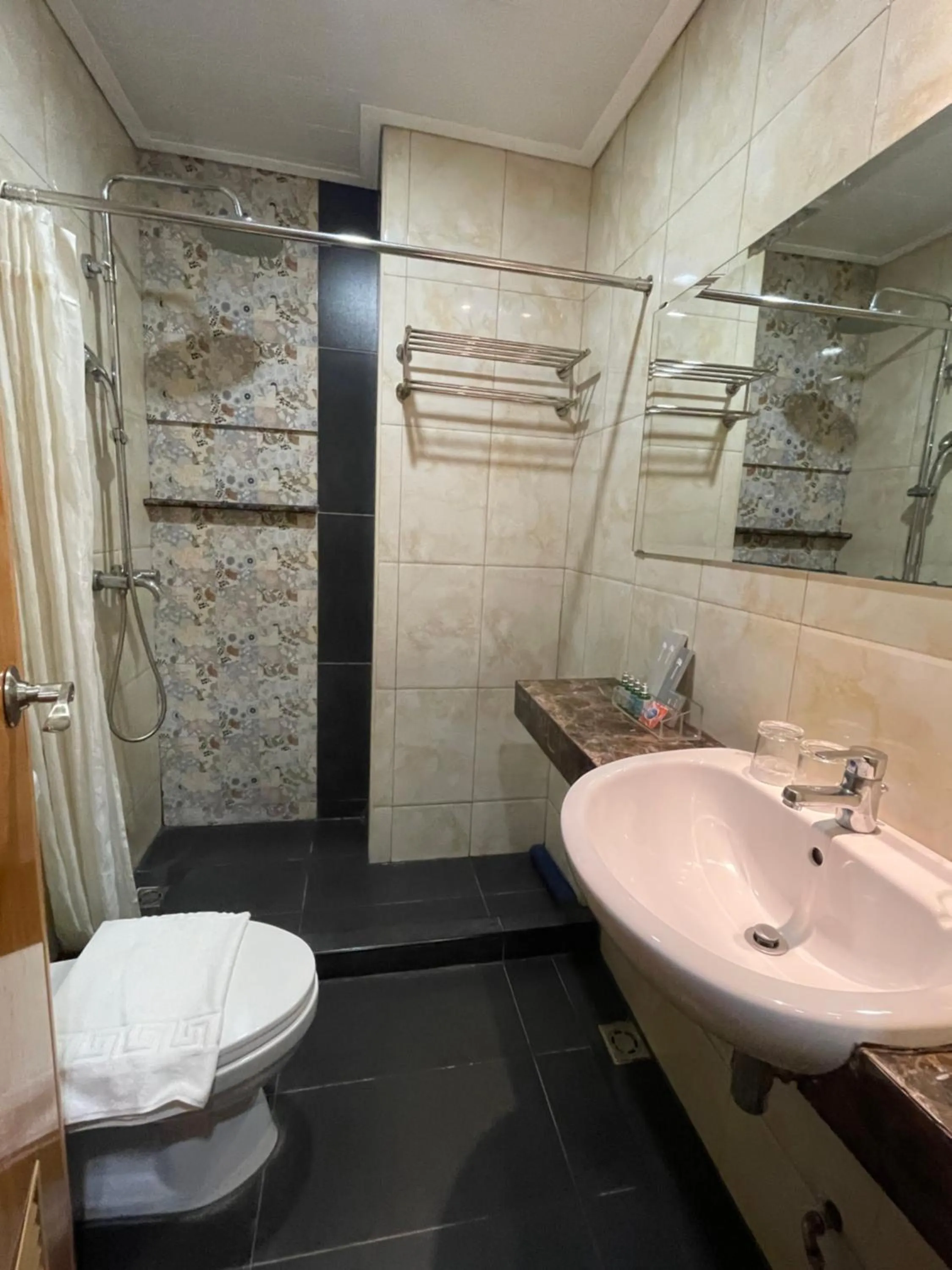Shower in Homes at Bay Area Suites by SMS Hospitality