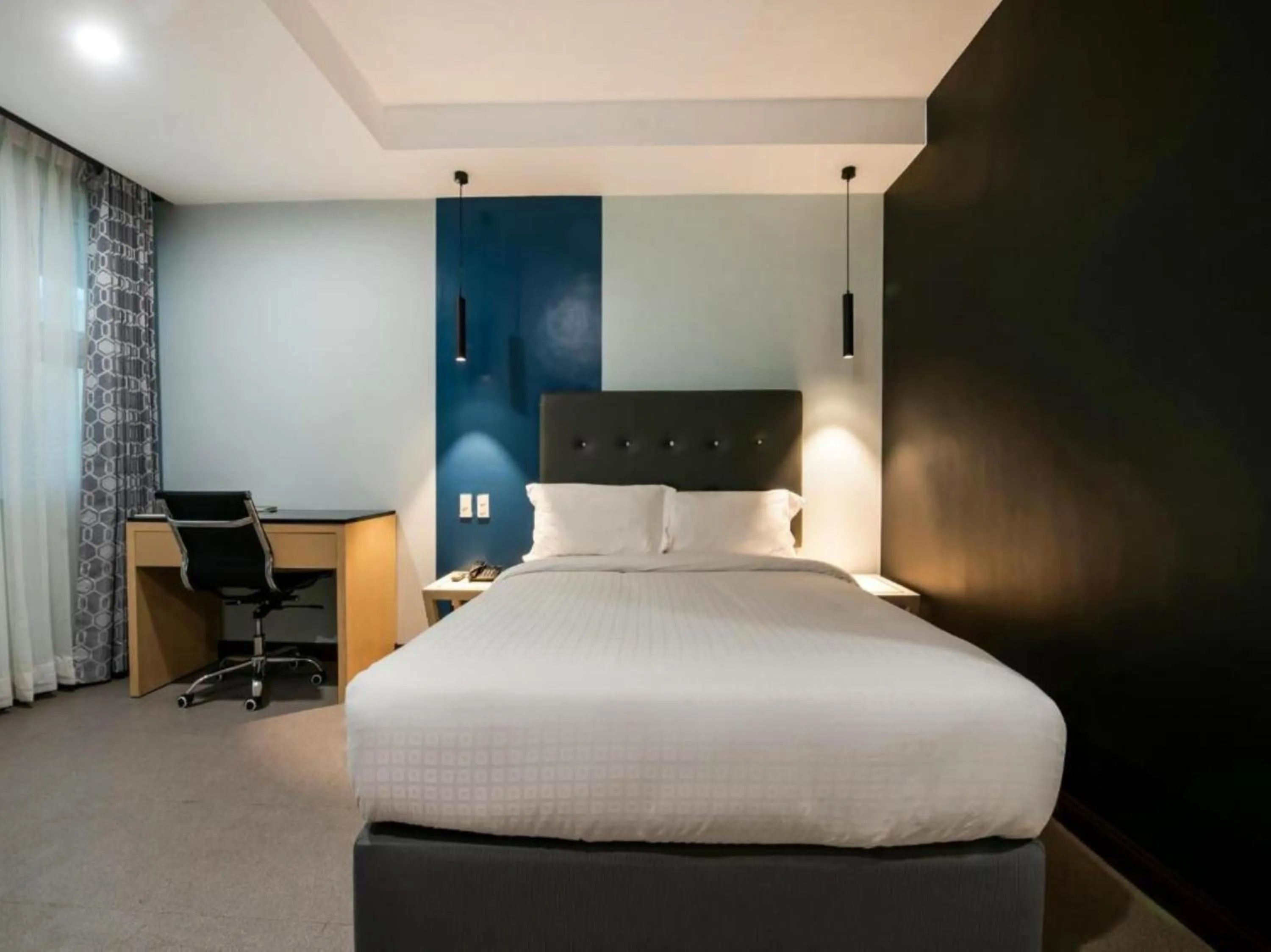 Bed in Homes at Bay Area Suites by SMS Hospitality