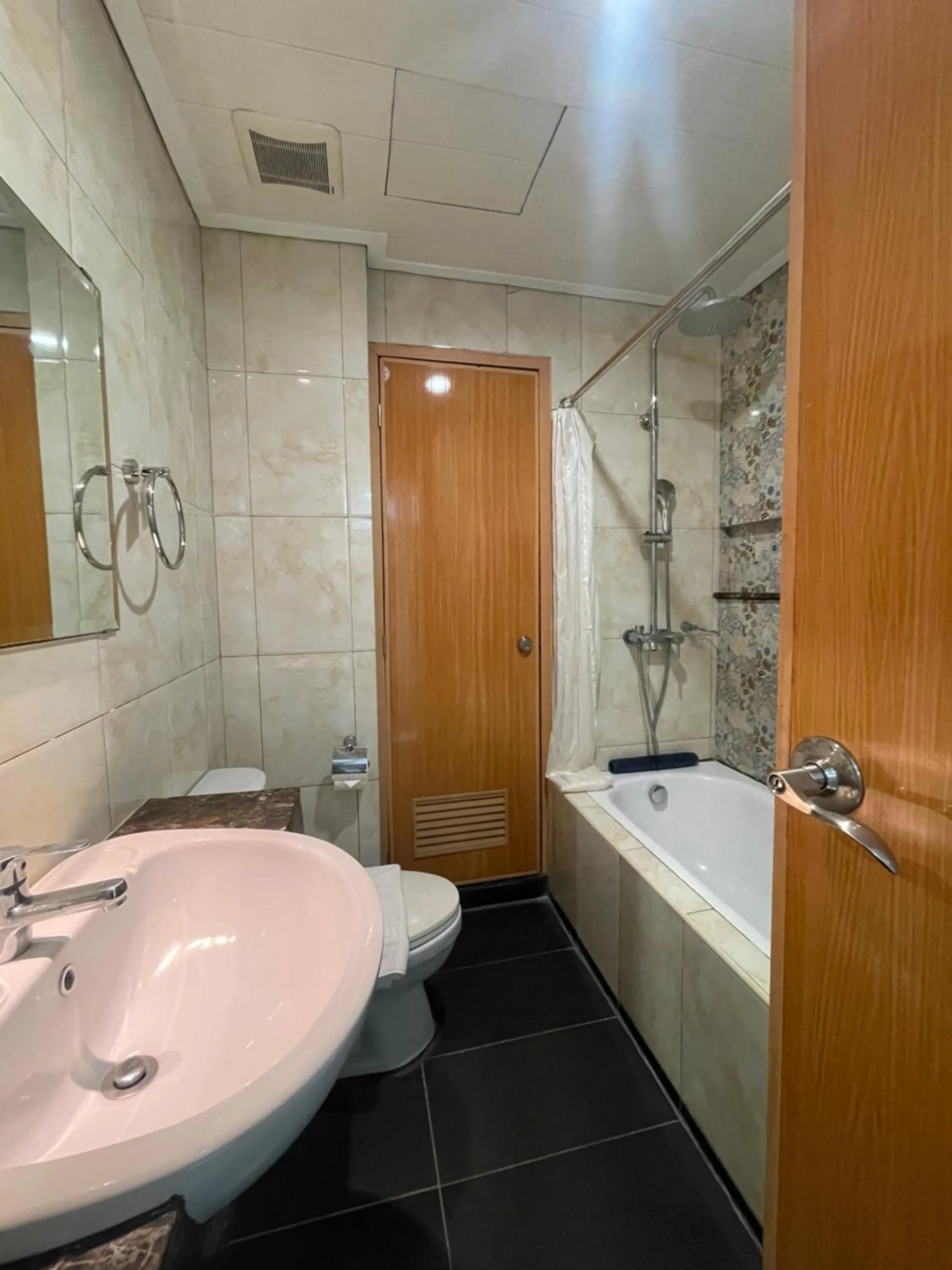Shower in Homes at Bay Area Suites by SMS Hospitality