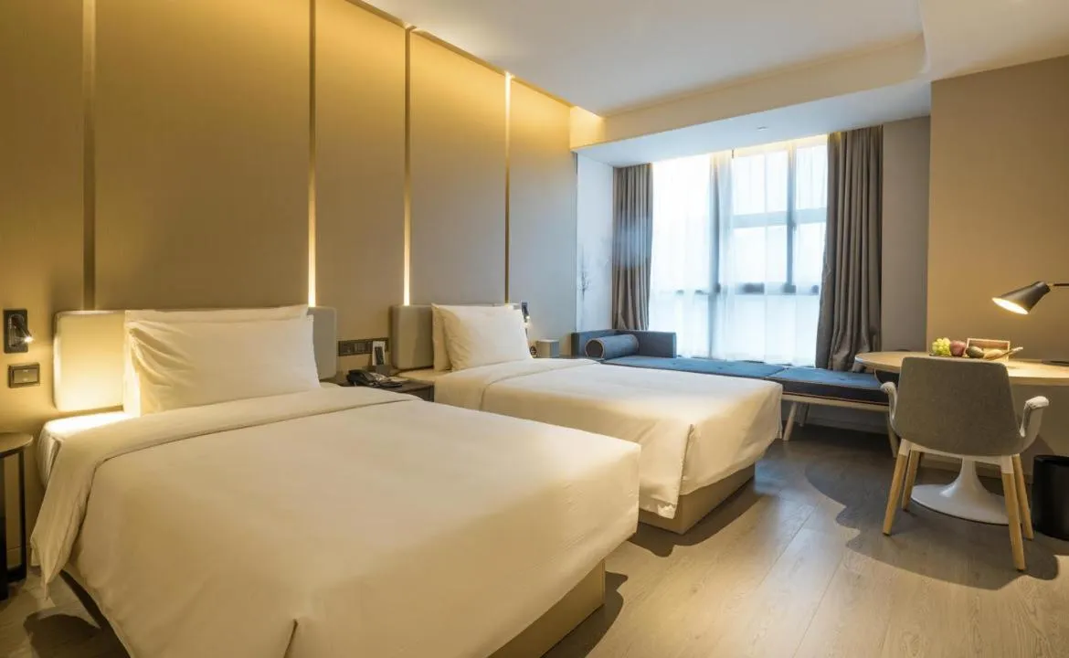 Bed in Atour Hotel Hangzhou Binjiang Olympic Sports