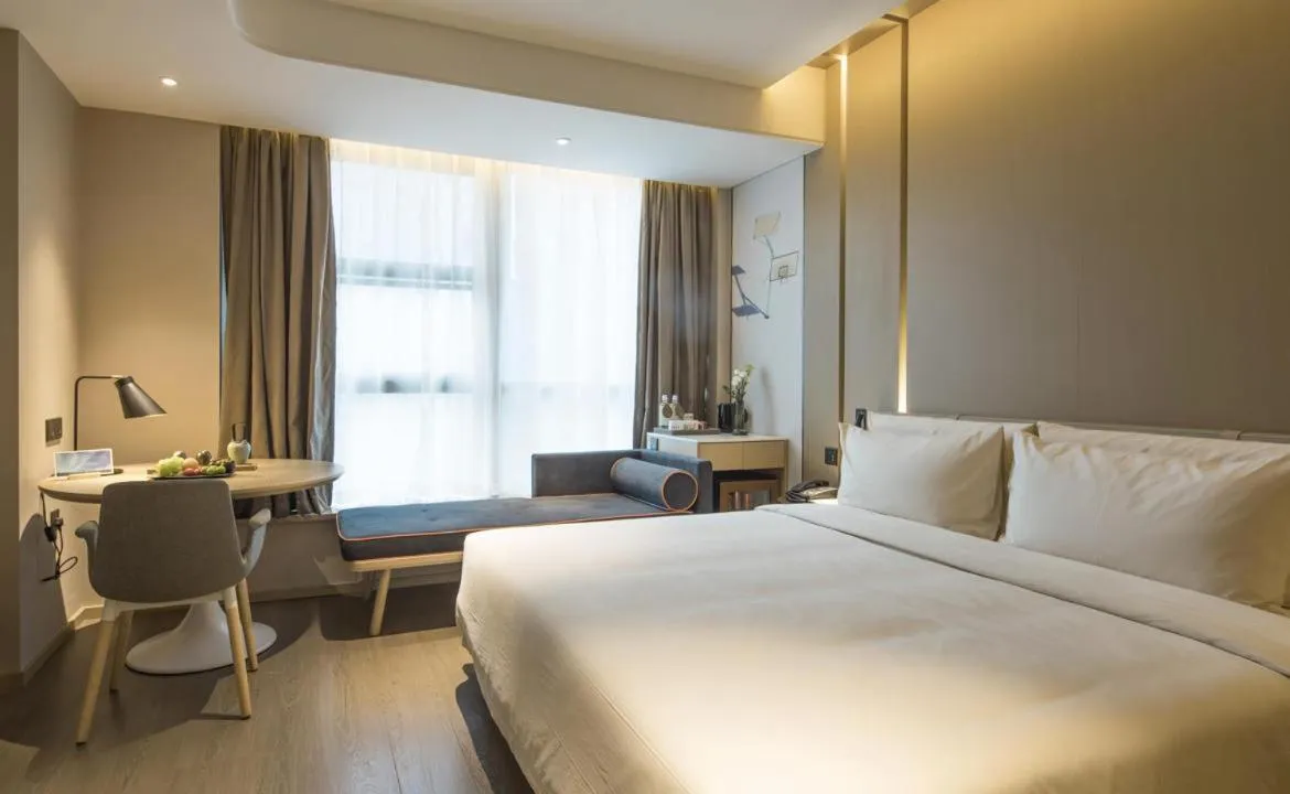 Bed in Atour Hotel Hangzhou Binjiang Olympic Sports
