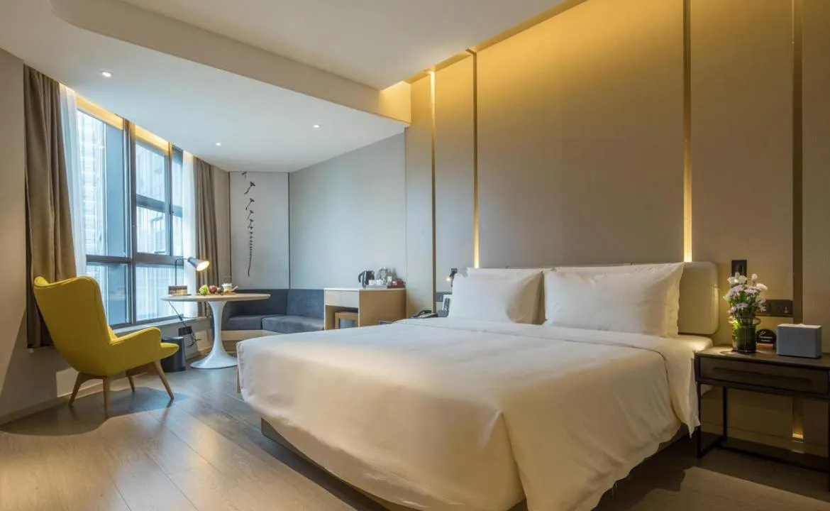 Bed in Atour Hotel Hangzhou Binjiang Olympic Sports