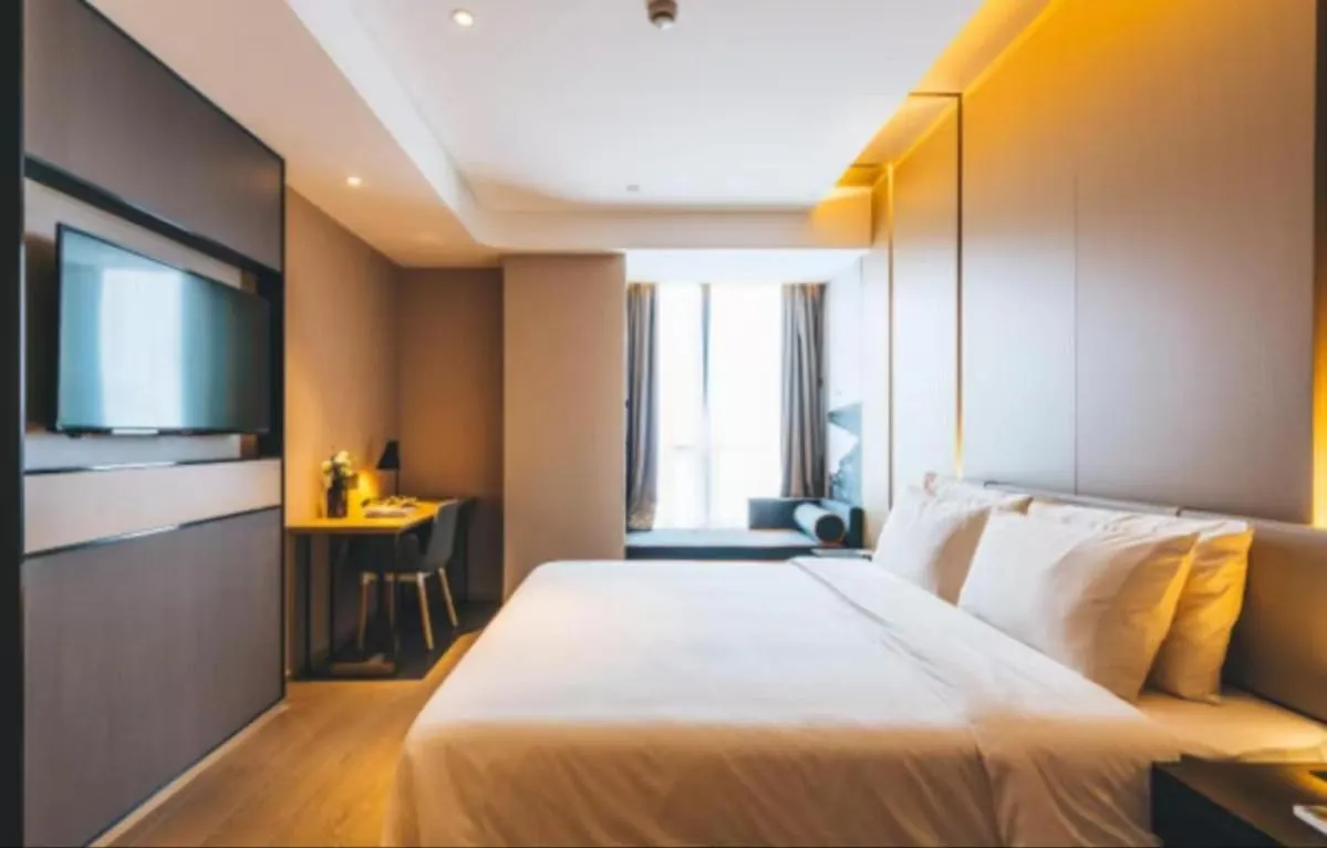 Bed in Atour Hotel Hangzhou Binjiang Olympic Sports