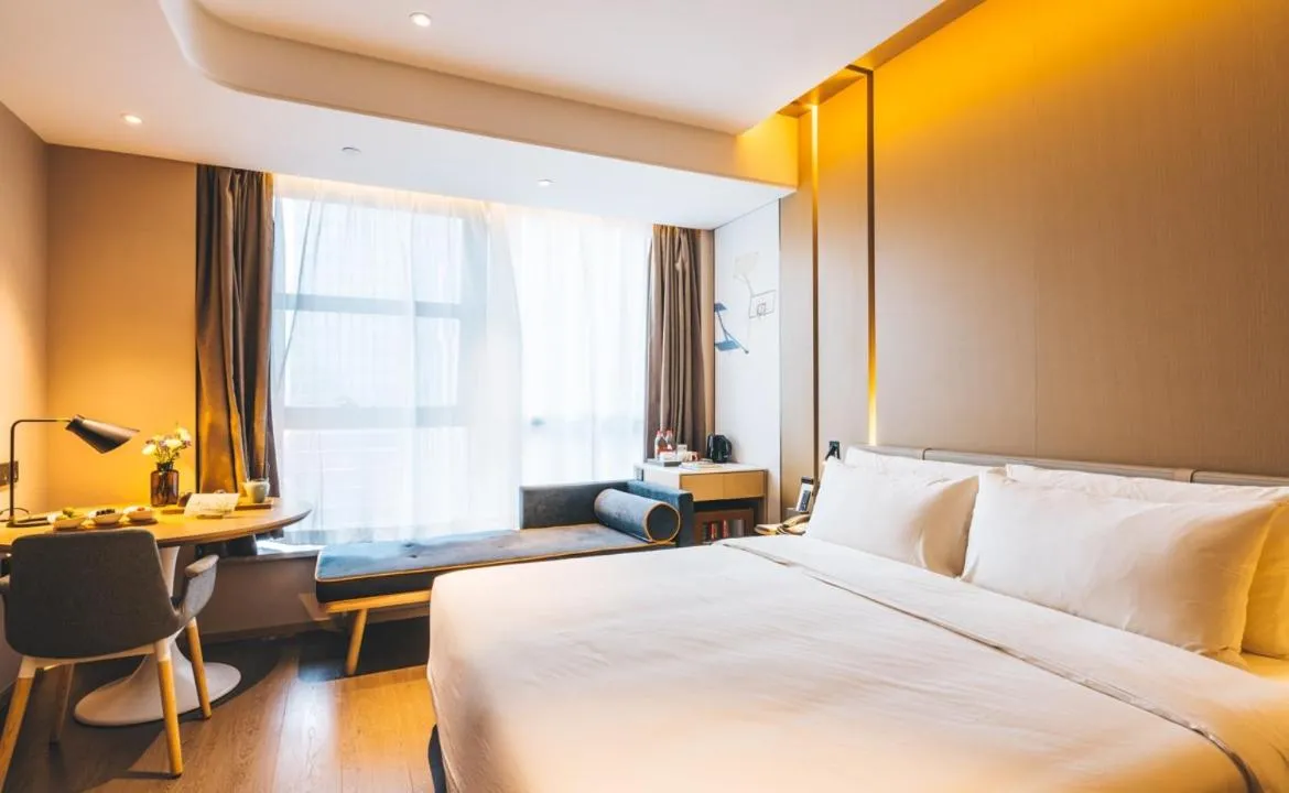 Bed in Atour Hotel Hangzhou Binjiang Olympic Sports