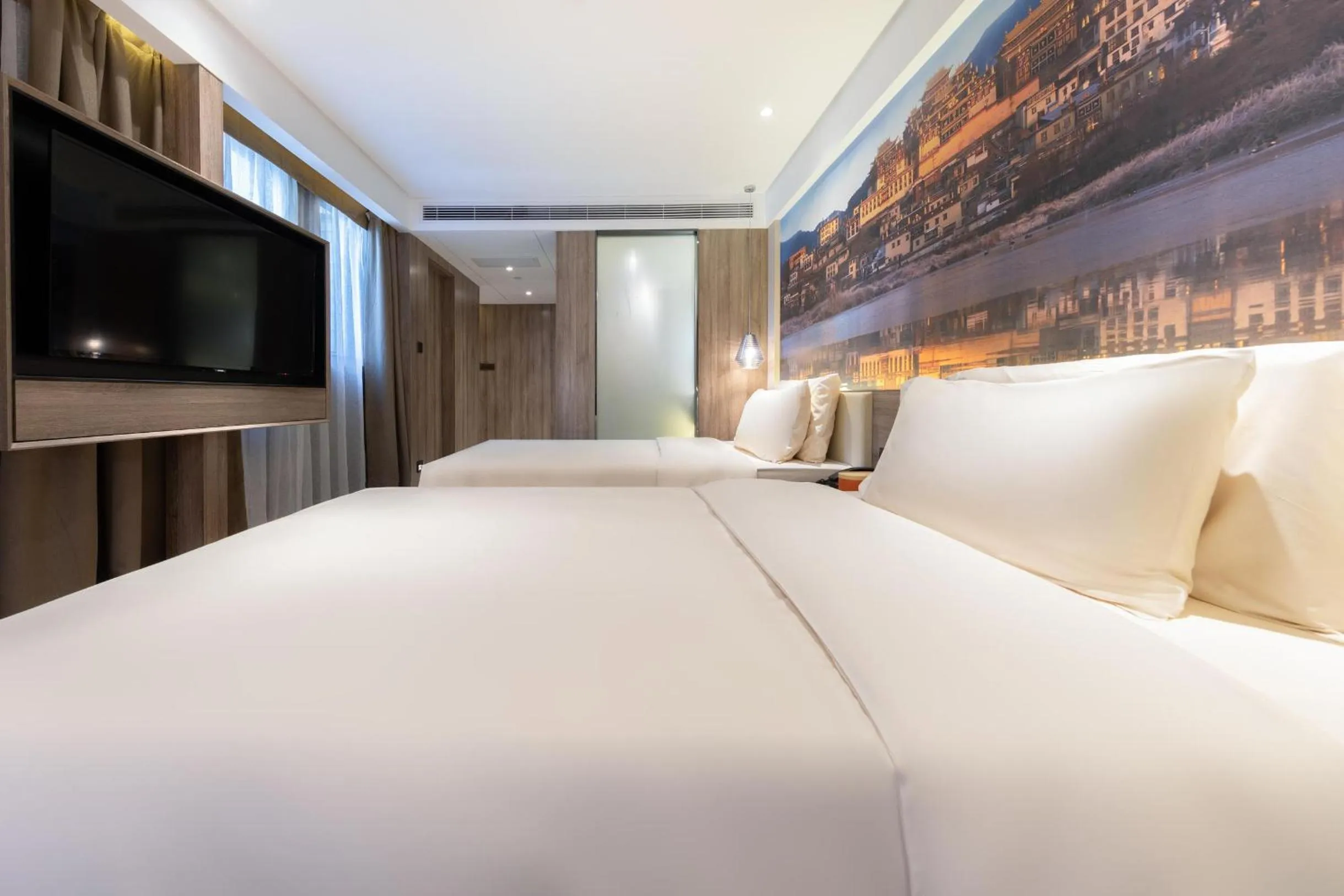 Bed in Atour Hotel Kunming South High Speed ​​Railway Station University Town