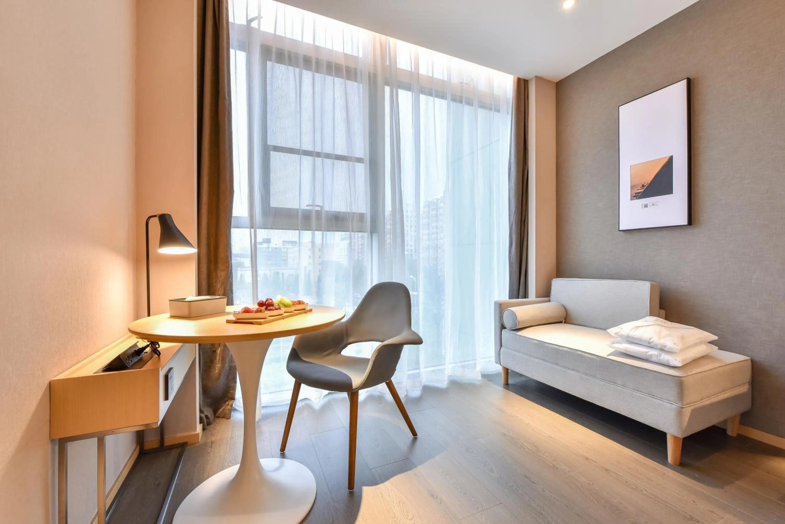 Seating area, Bed in Atour Hotel Wangjing SOHO