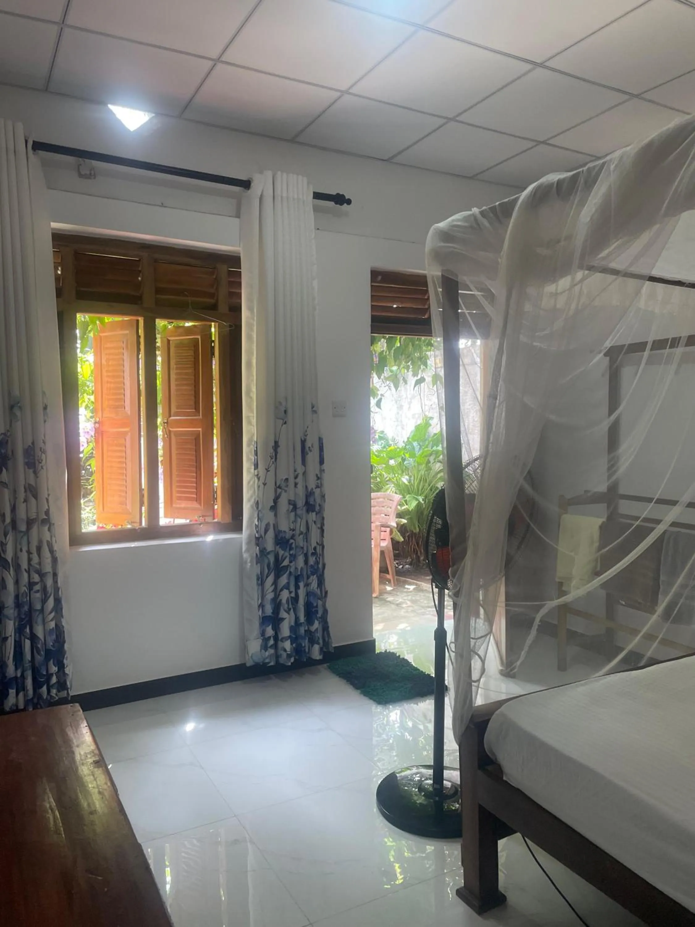 Bed in Ananda Home Stay and Restaurant