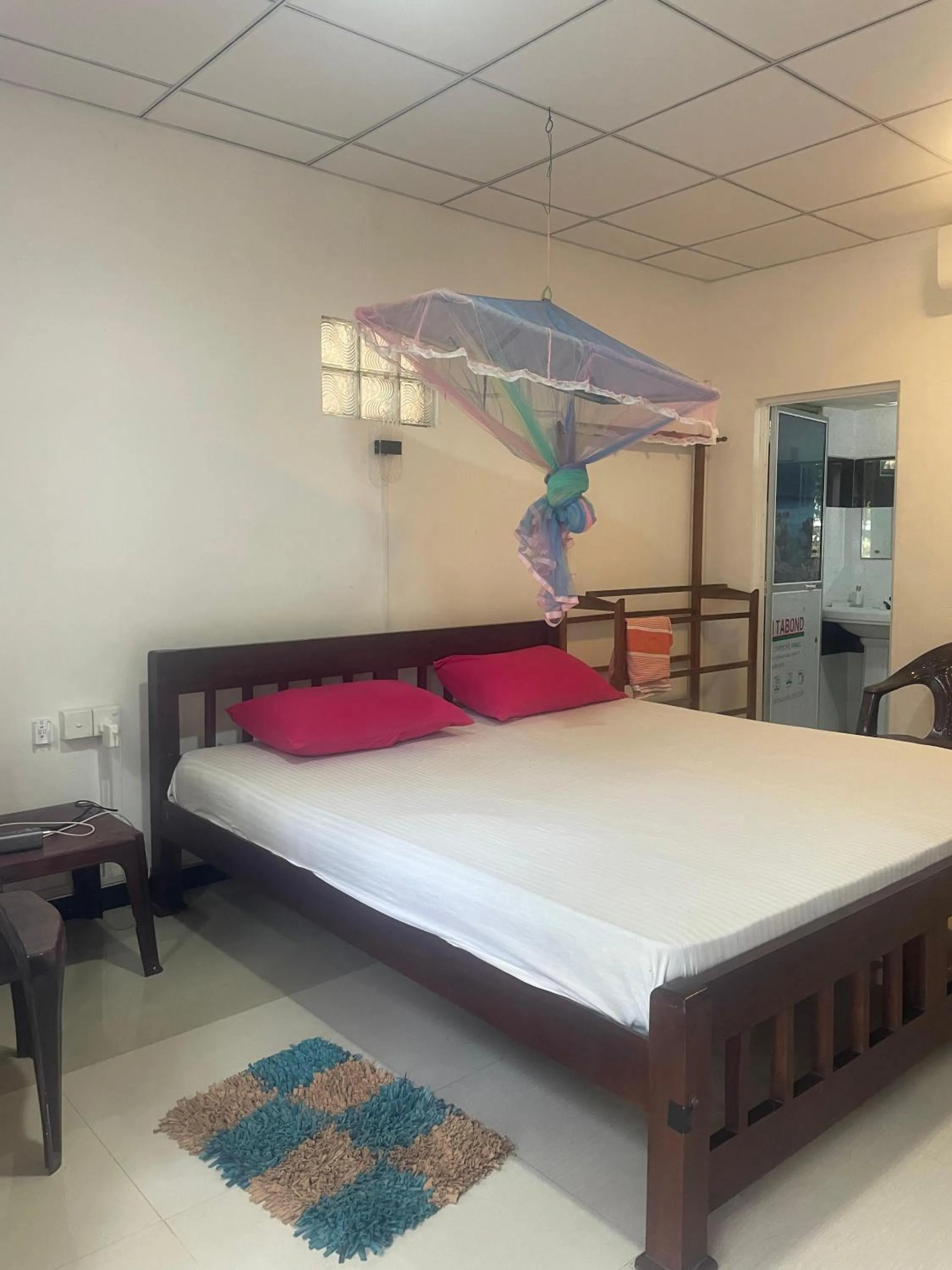Bed in Ananda Home Stay and Restaurant