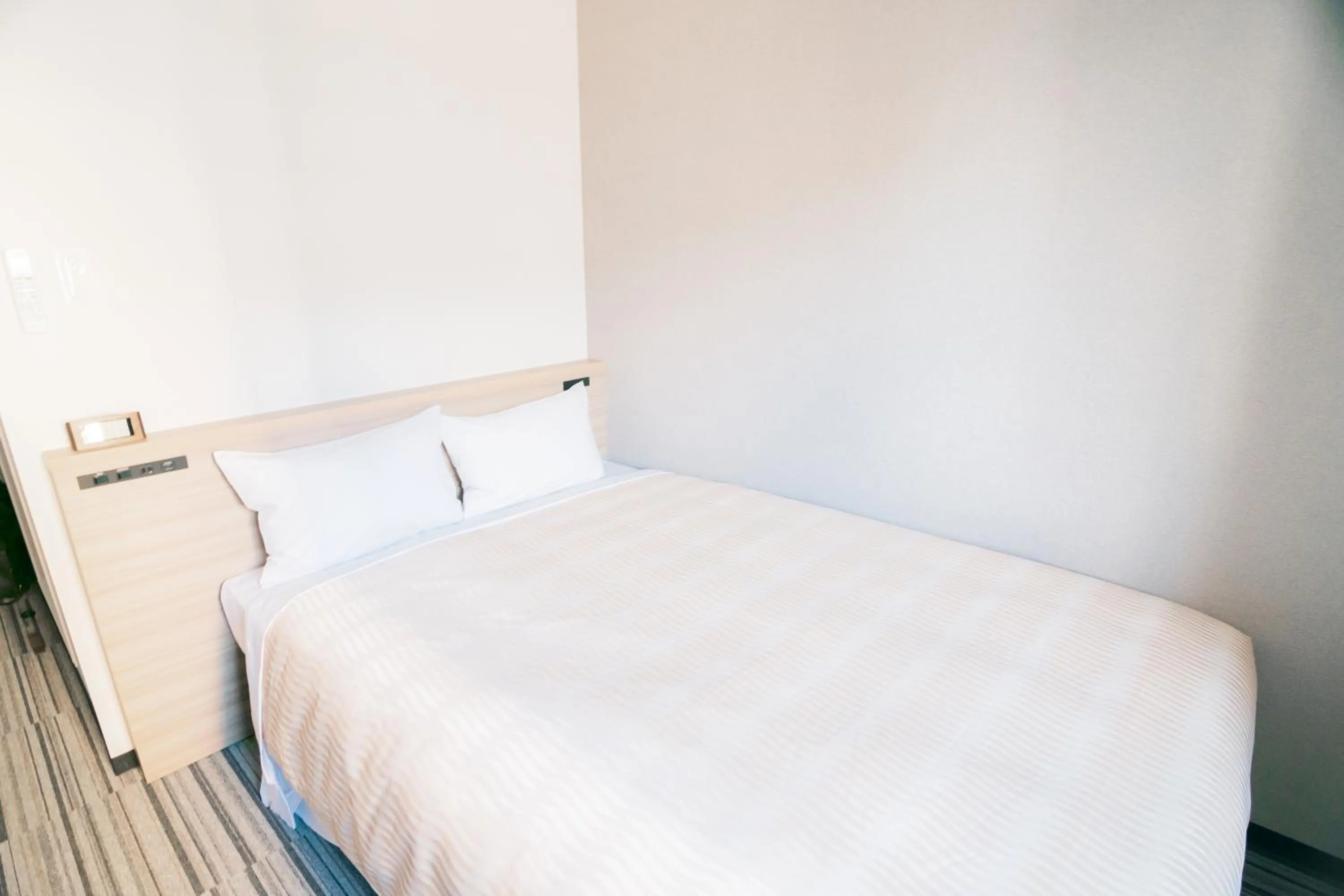 Bed in Quintessa Hotel Chiba Funabashi