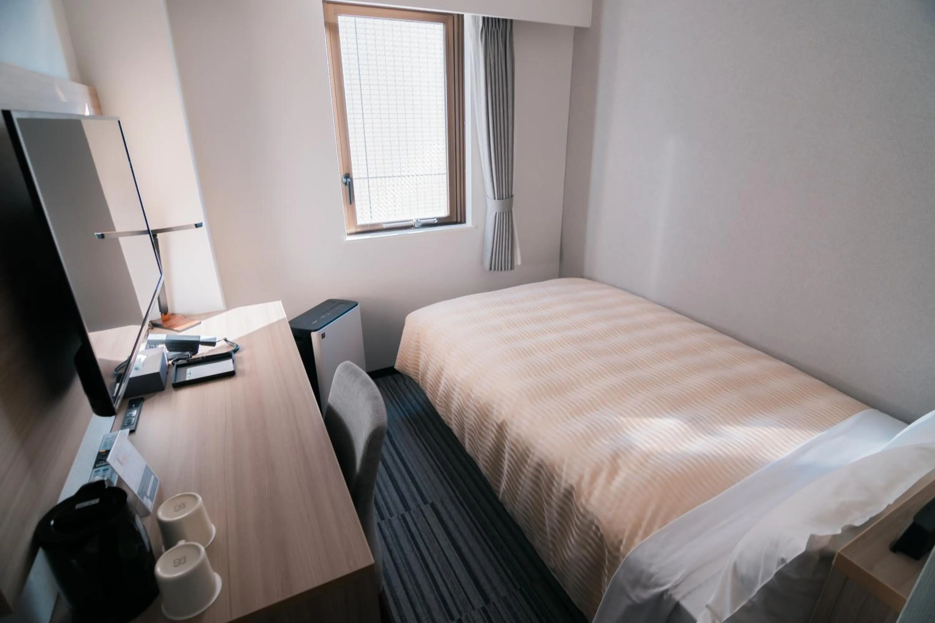 Bed in Quintessa Hotel Chiba Funabashi