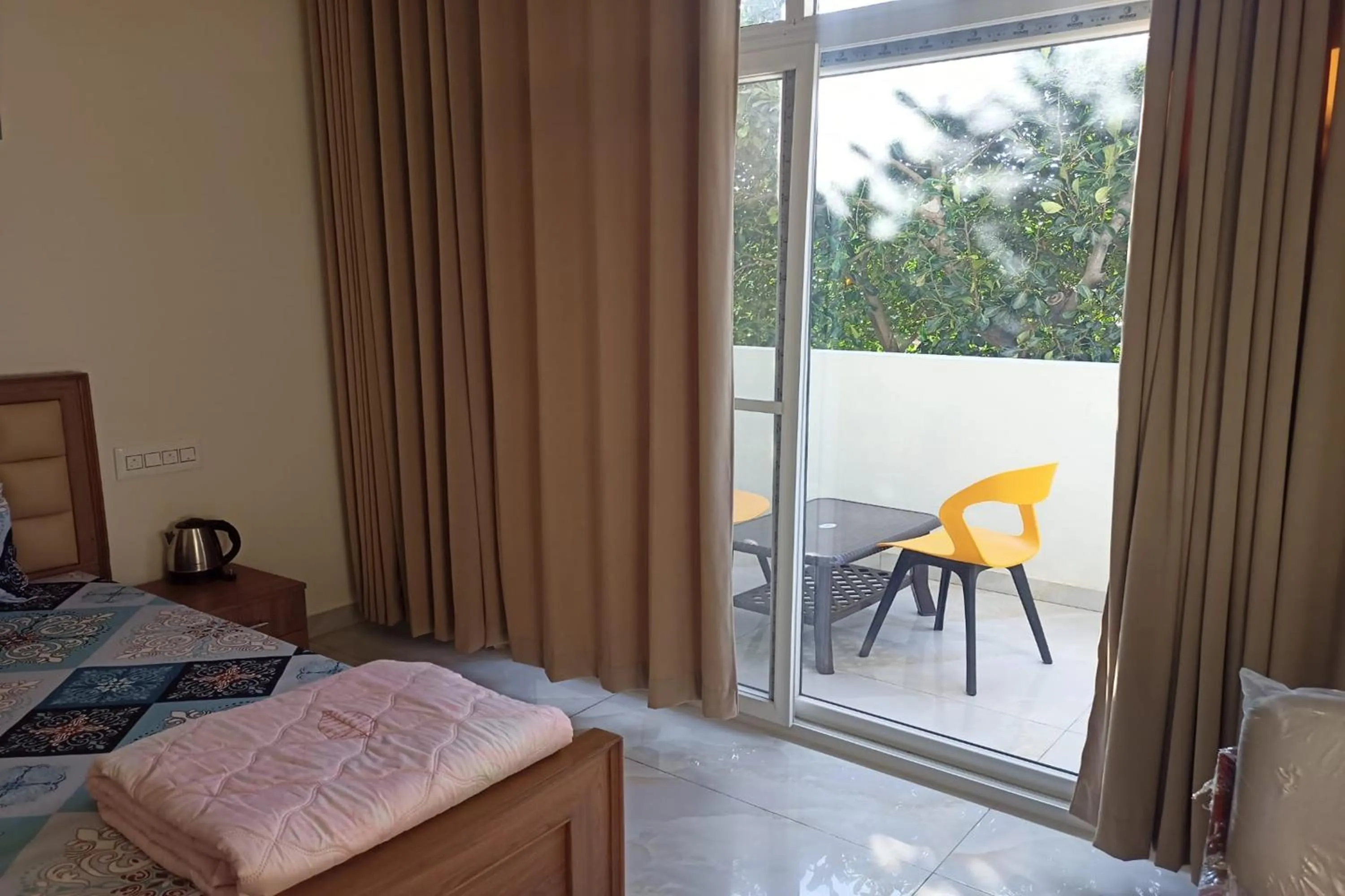 Bed in Dundi Mango Mist Resort