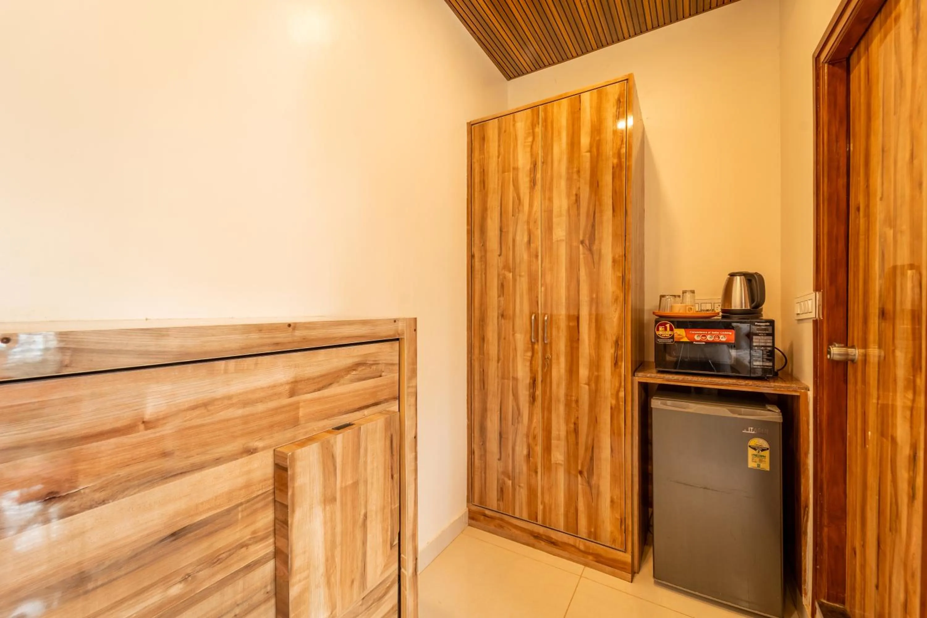 Kitchen or kitchenette in The Suites