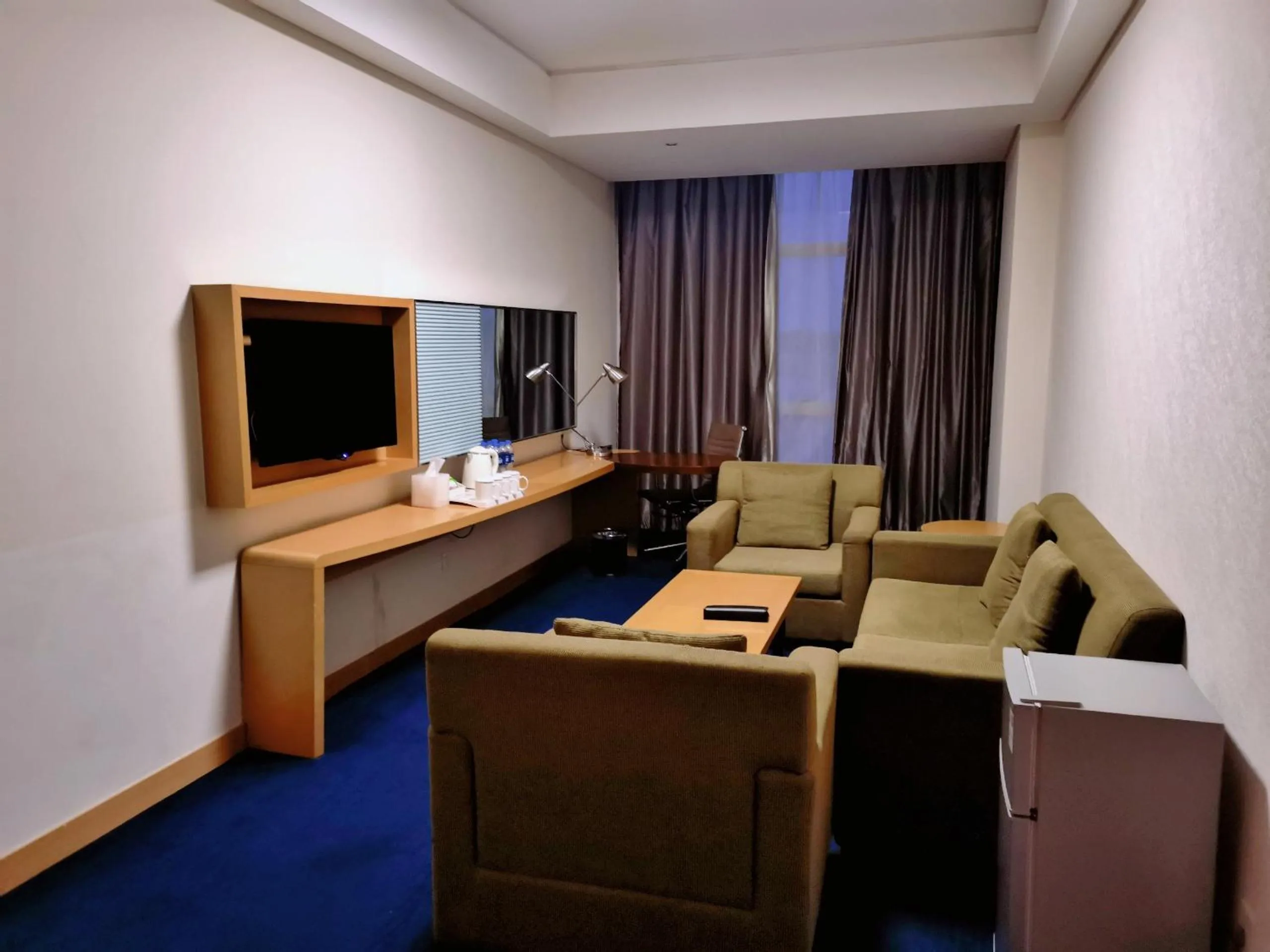 Living room in Holiday Inn Express Zhengzhou Airport by IHG