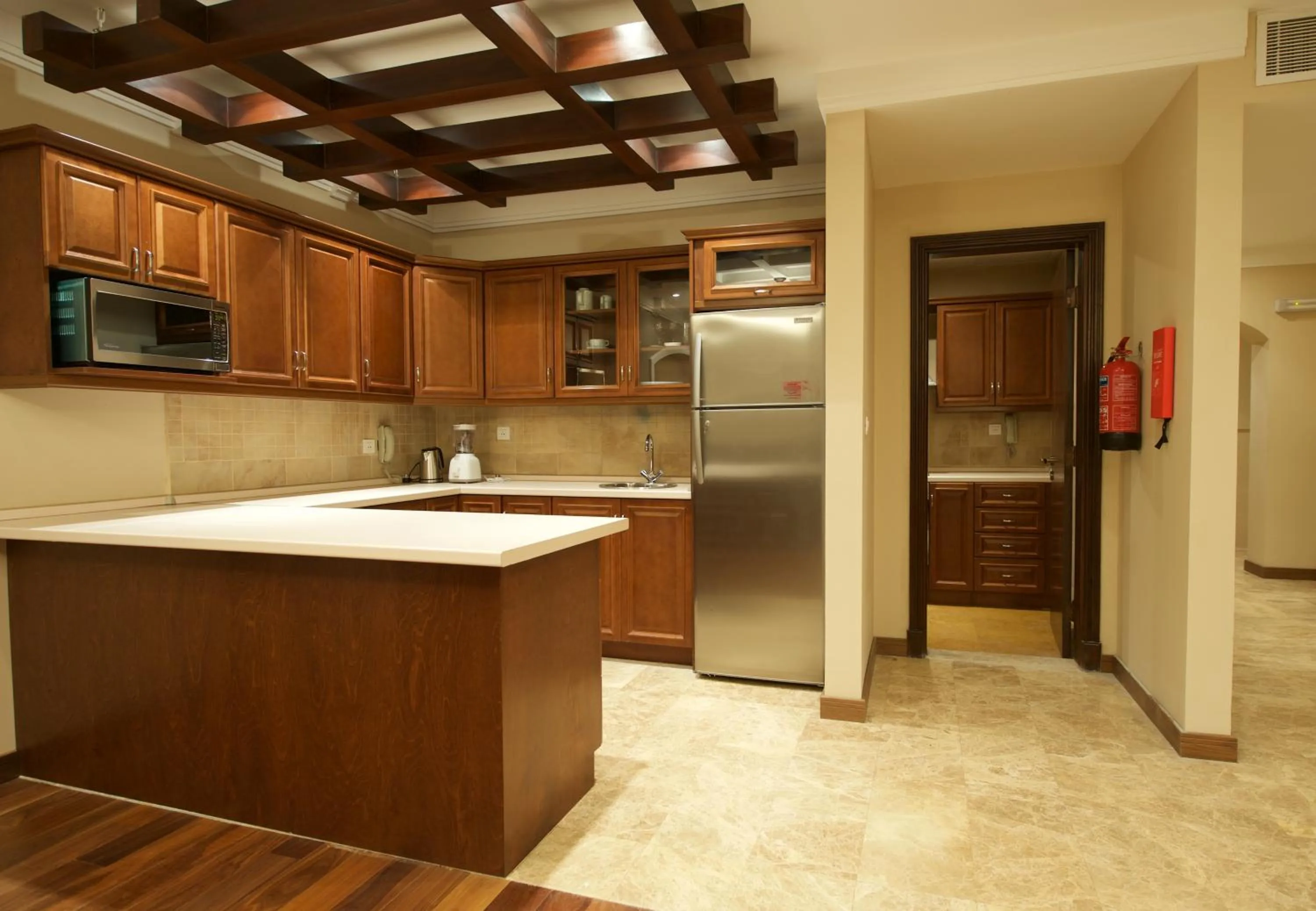 Kitchen or kitchenette in Rawasi Hotel Apartments
