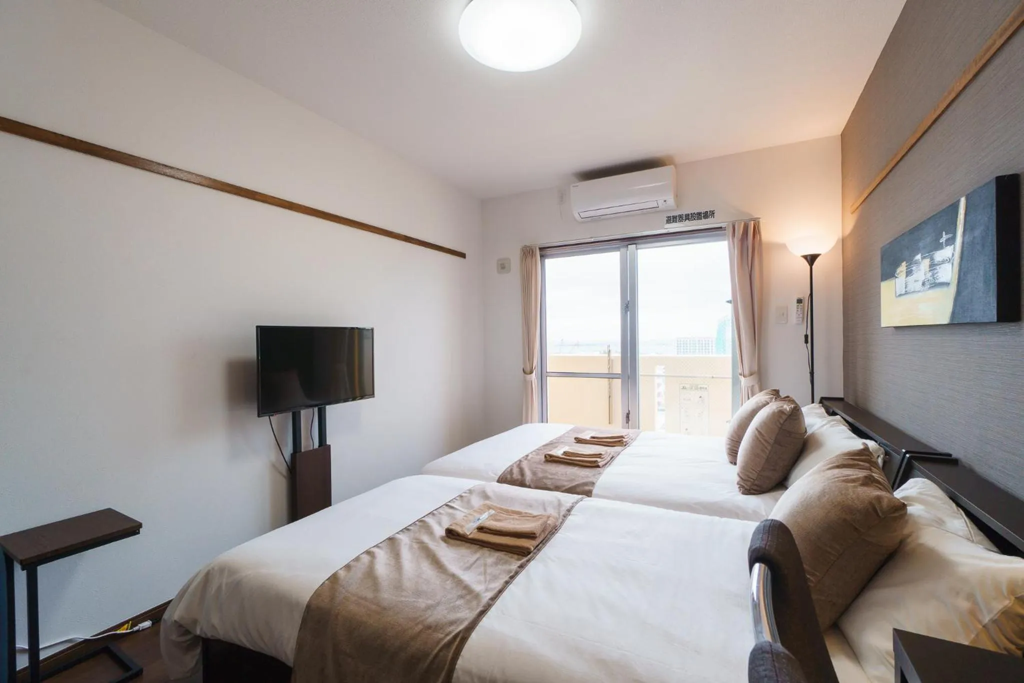 Bed in KINTARO Hotel Okinawa Naha