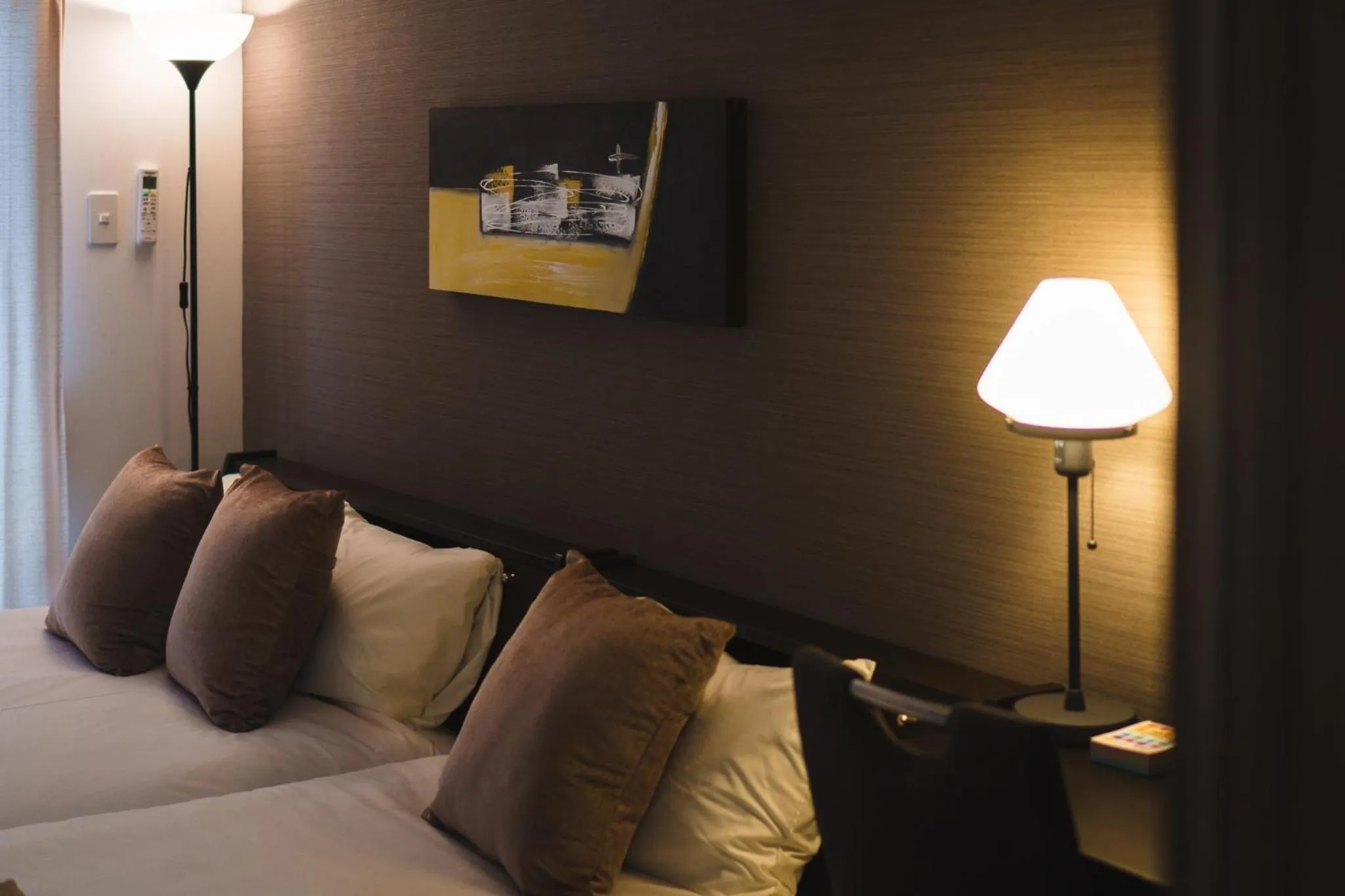 Bed in KINTARO Hotel Okinawa Naha