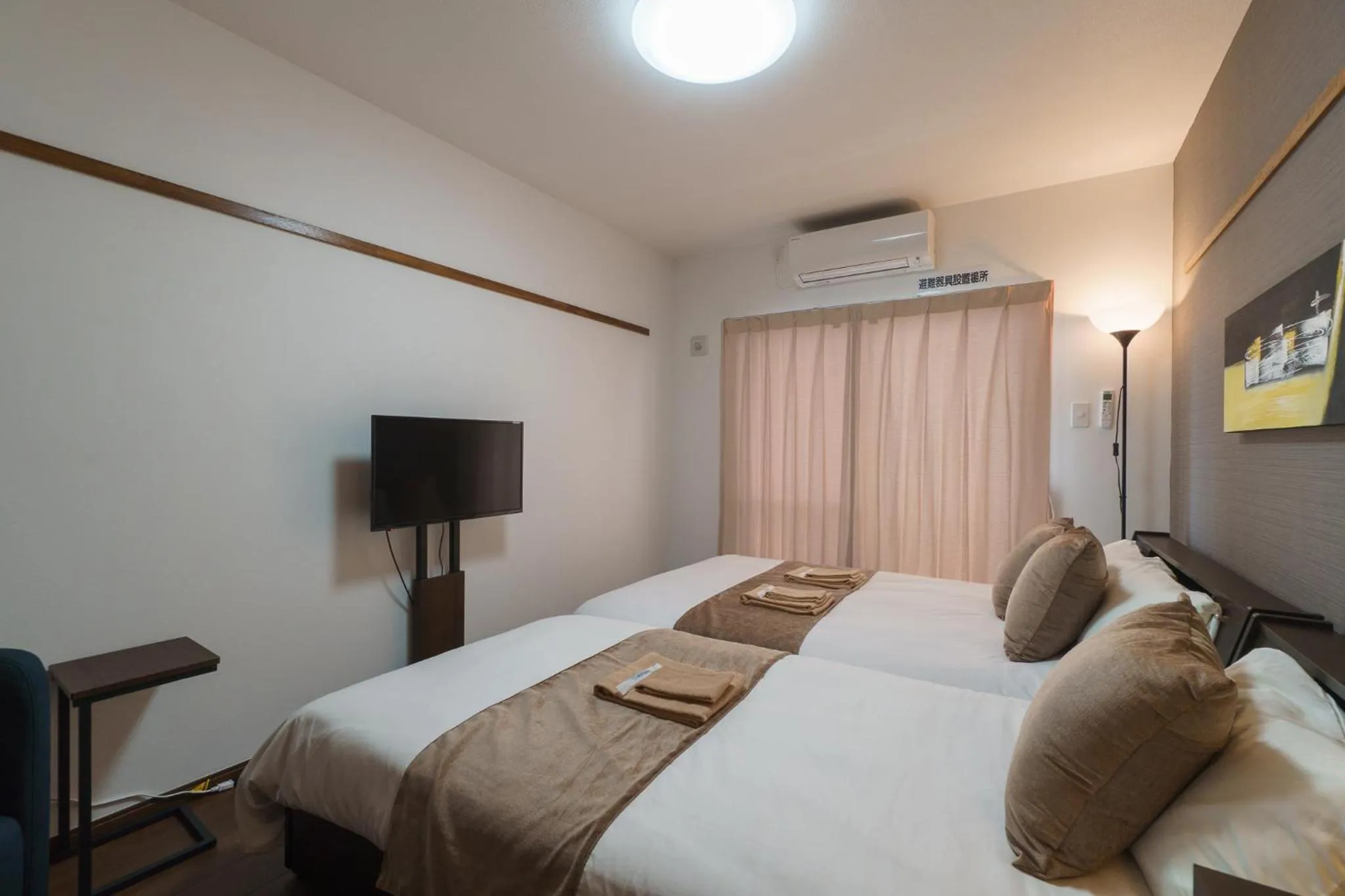 Bed in KINTARO Hotel Okinawa Naha