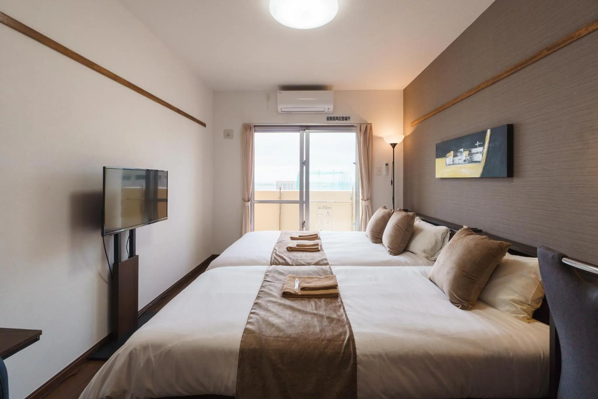 Bed in KINTARO Hotel Okinawa Naha