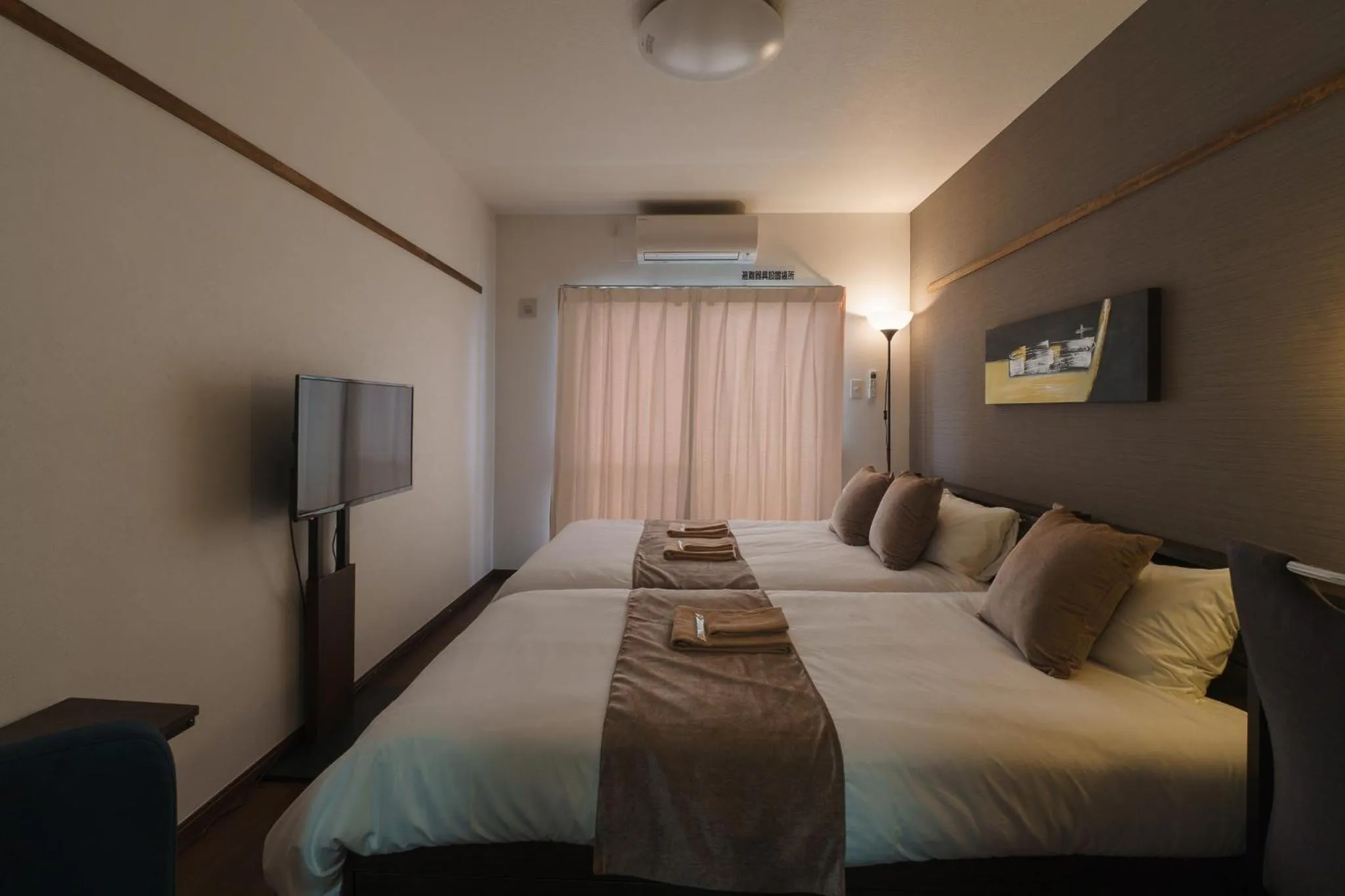 Bed in KINTARO Hotel Okinawa Naha