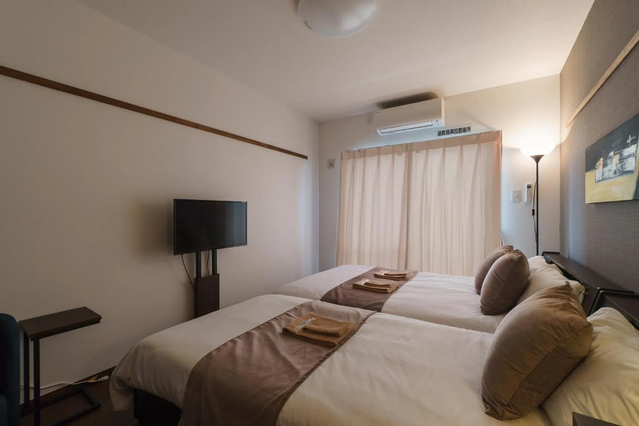 Bed in KINTARO Hotel Okinawa Naha