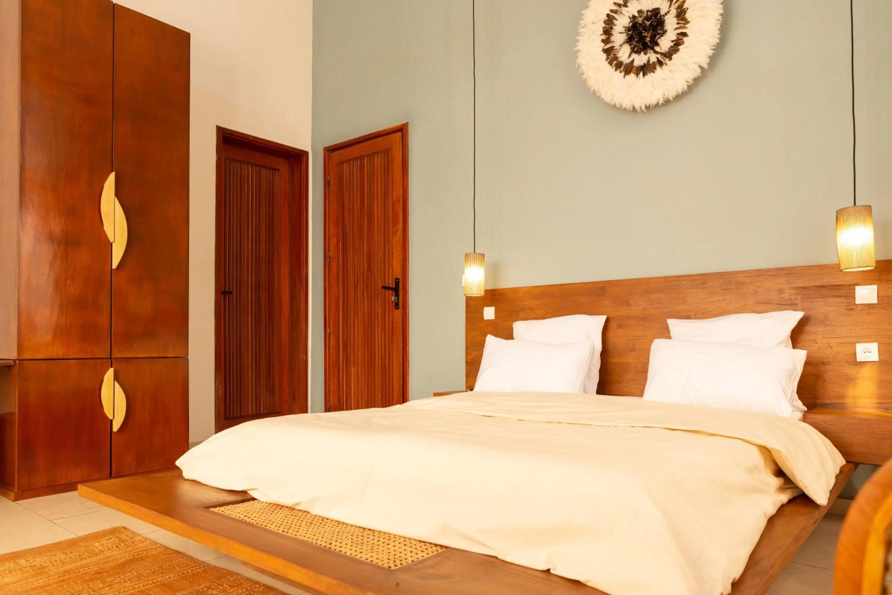 Bed in Tamarin Hôtel Cotonou